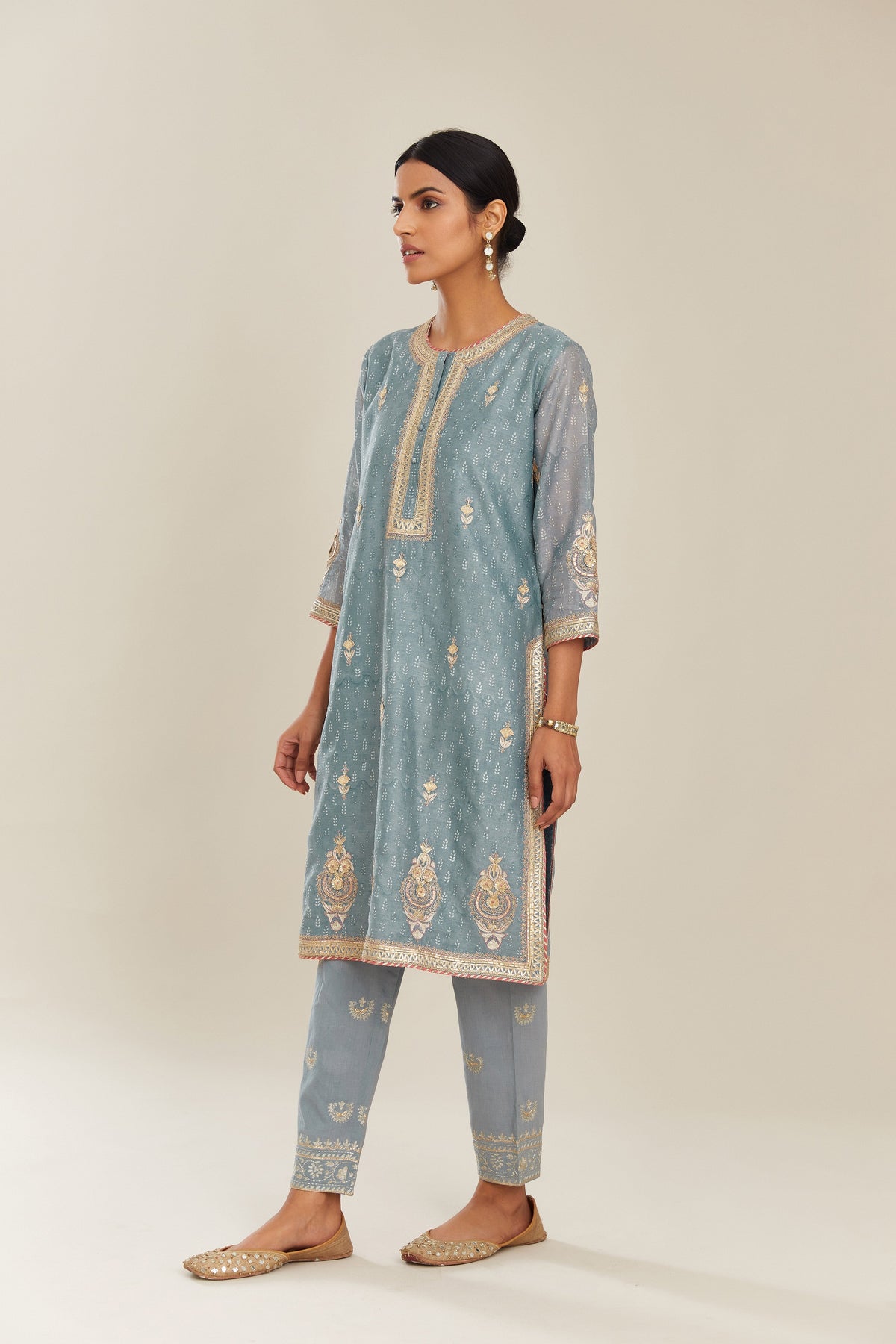 Powder blue hand block printed silk chanderi short kurta set, highlighted with gold gota and zari embroidery.