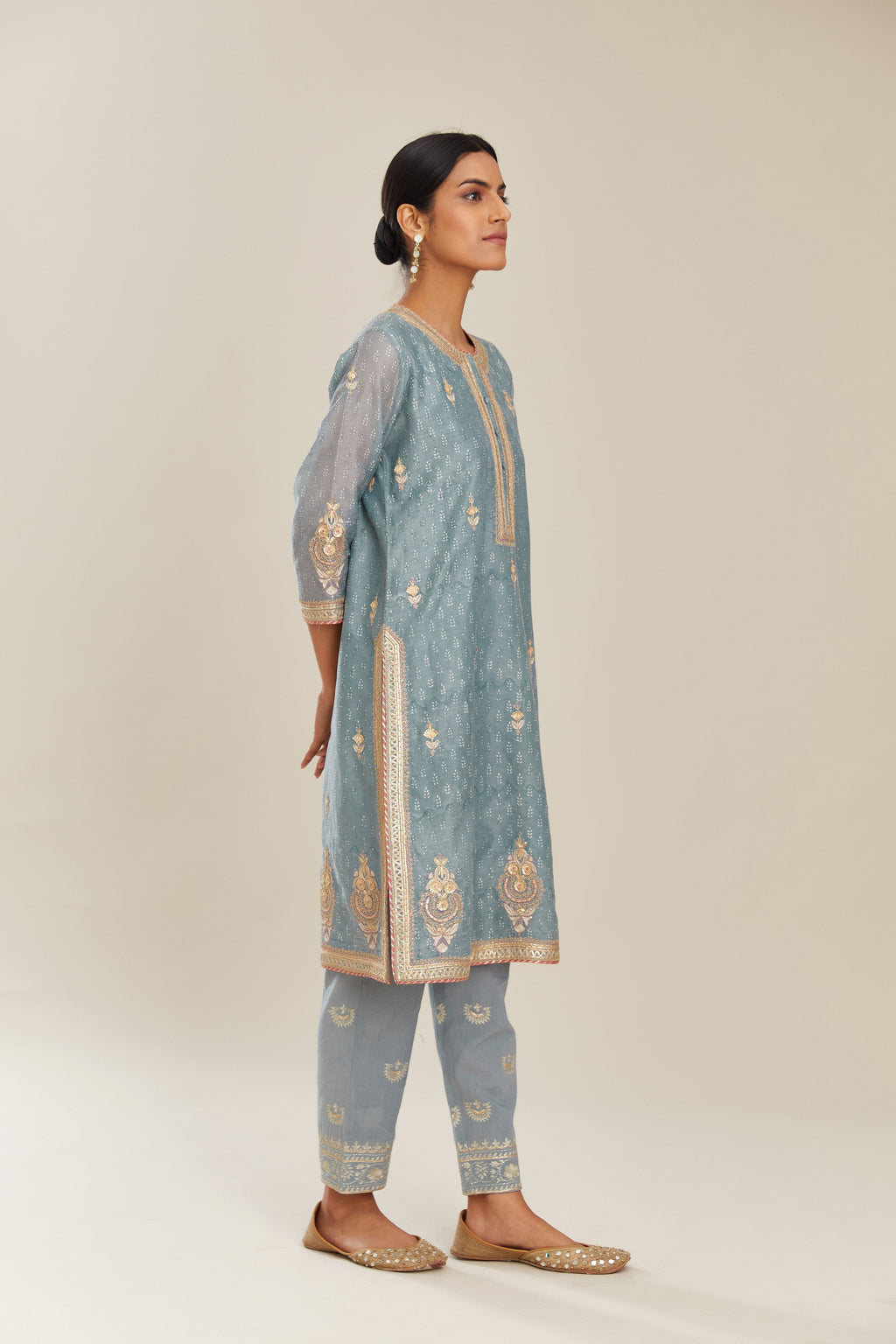 Powder blue hand block printed silk chanderi short kurta set, highlighted with gold gota and zari embroidery.