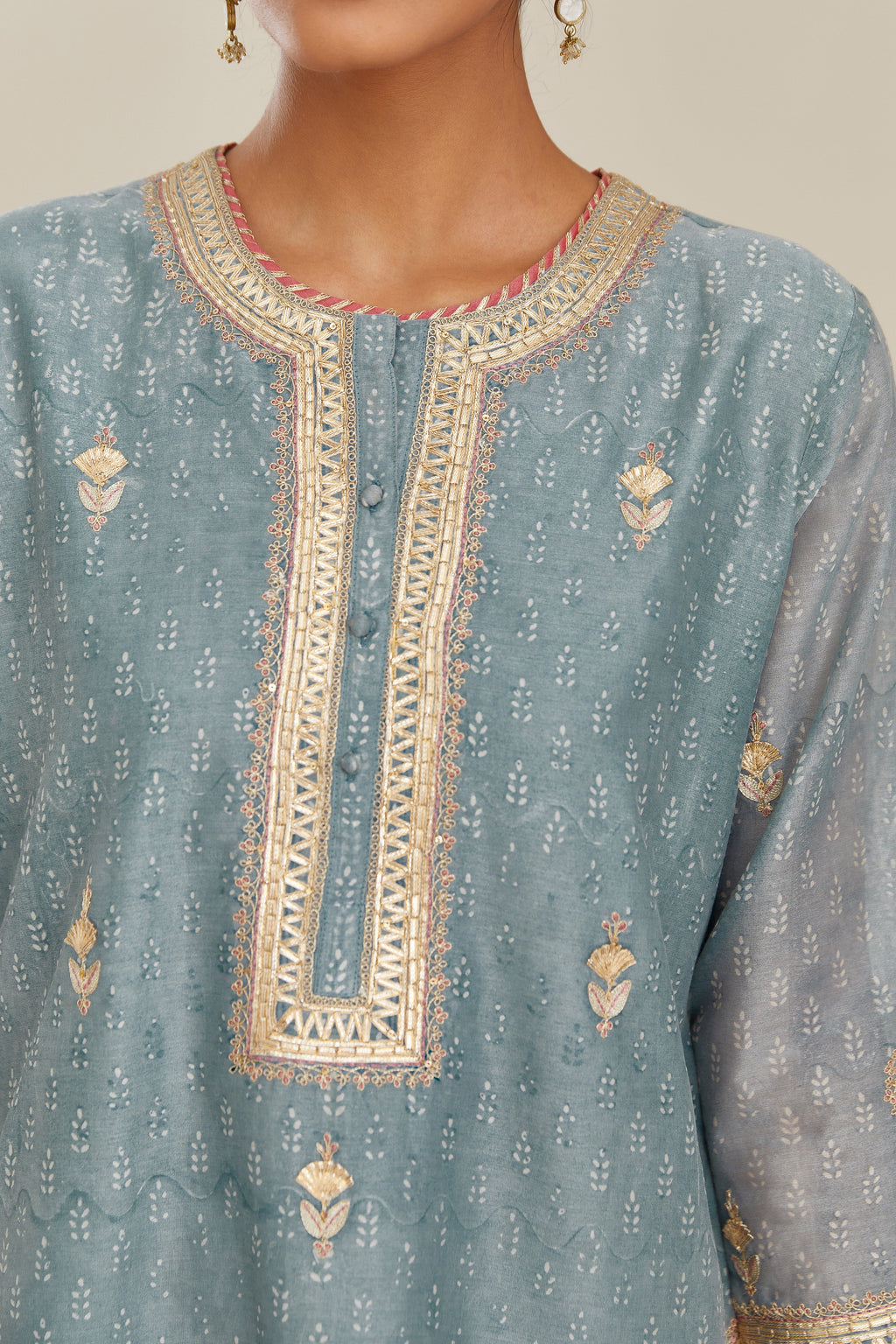 Powder blue hand block printed silk chanderi short kurta set, highlighted with gold gota and zari embroidery.