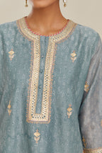 Powder blue hand block printed silk chanderi short kurta set, highlighted with gold gota and zari embroidery.