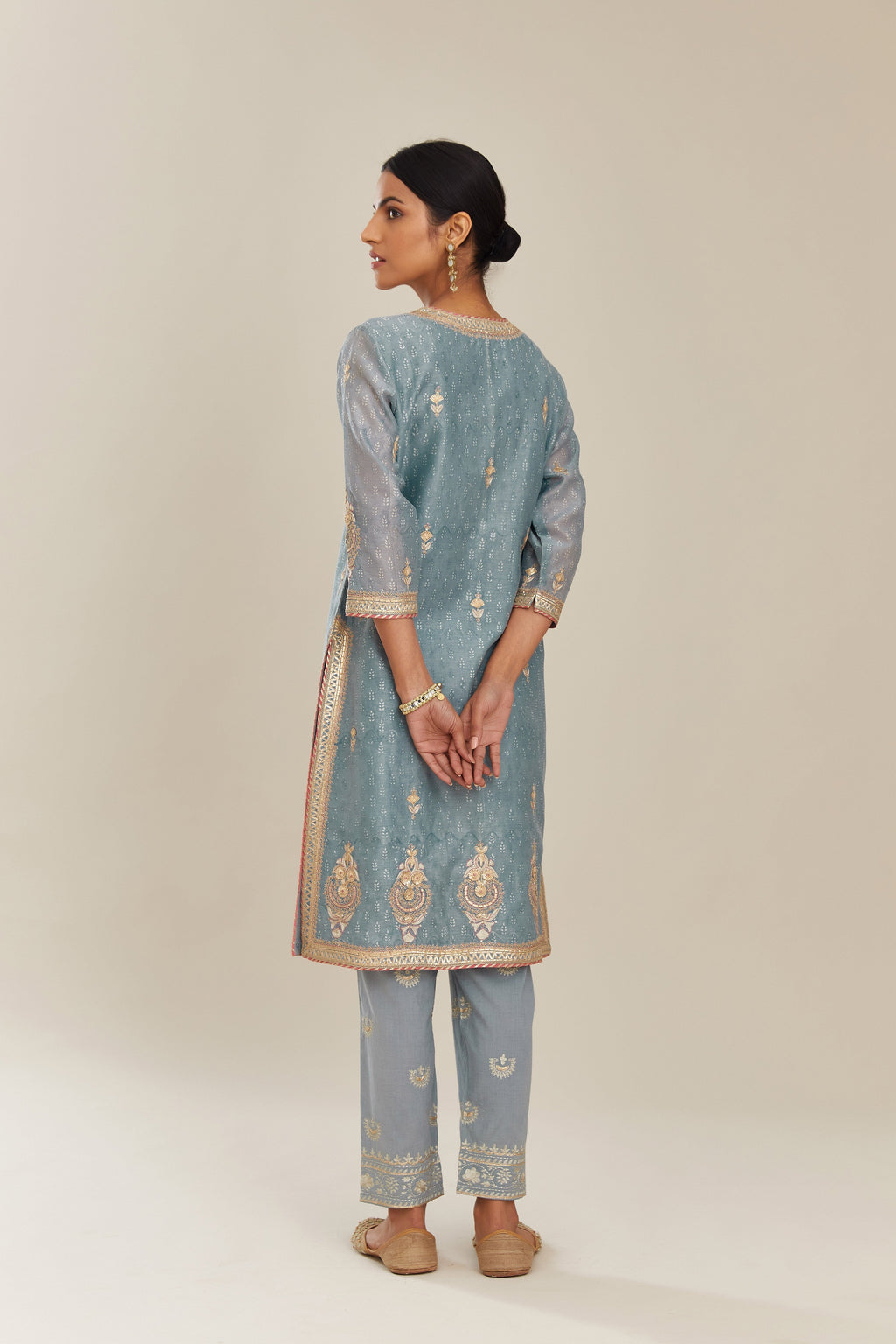 Powder blue hand block printed silk chanderi short kurta set, highlighted with gold gota and zari embroidery.