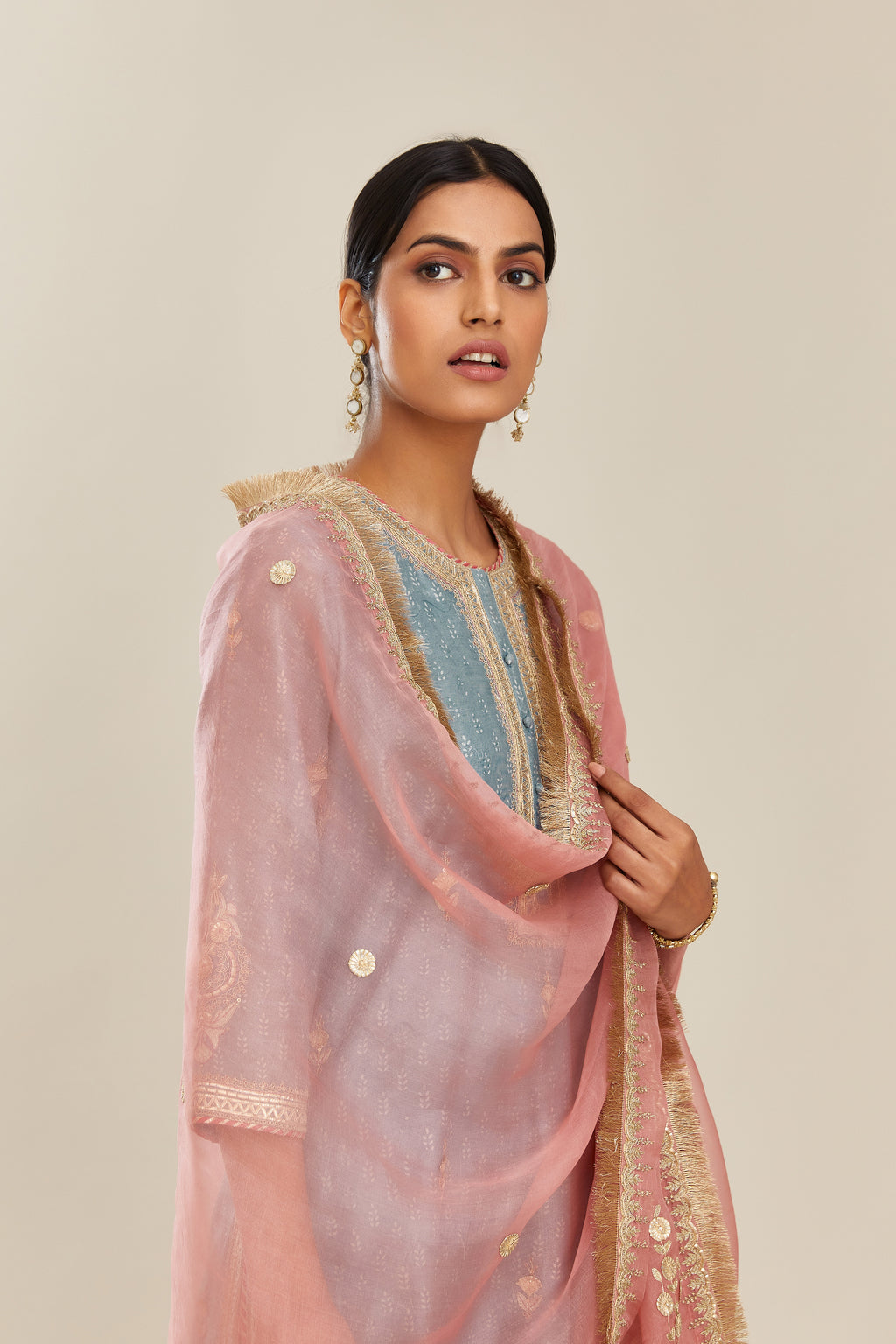 Powder blue hand block printed silk chanderi short kurta set, highlighted with gold gota and zari embroidery.
