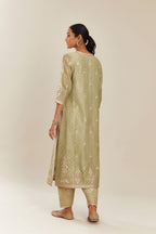 Sage green hand block printed silk chanderi kurta set with side panels, highlighted with gold gota and zari embroidery.