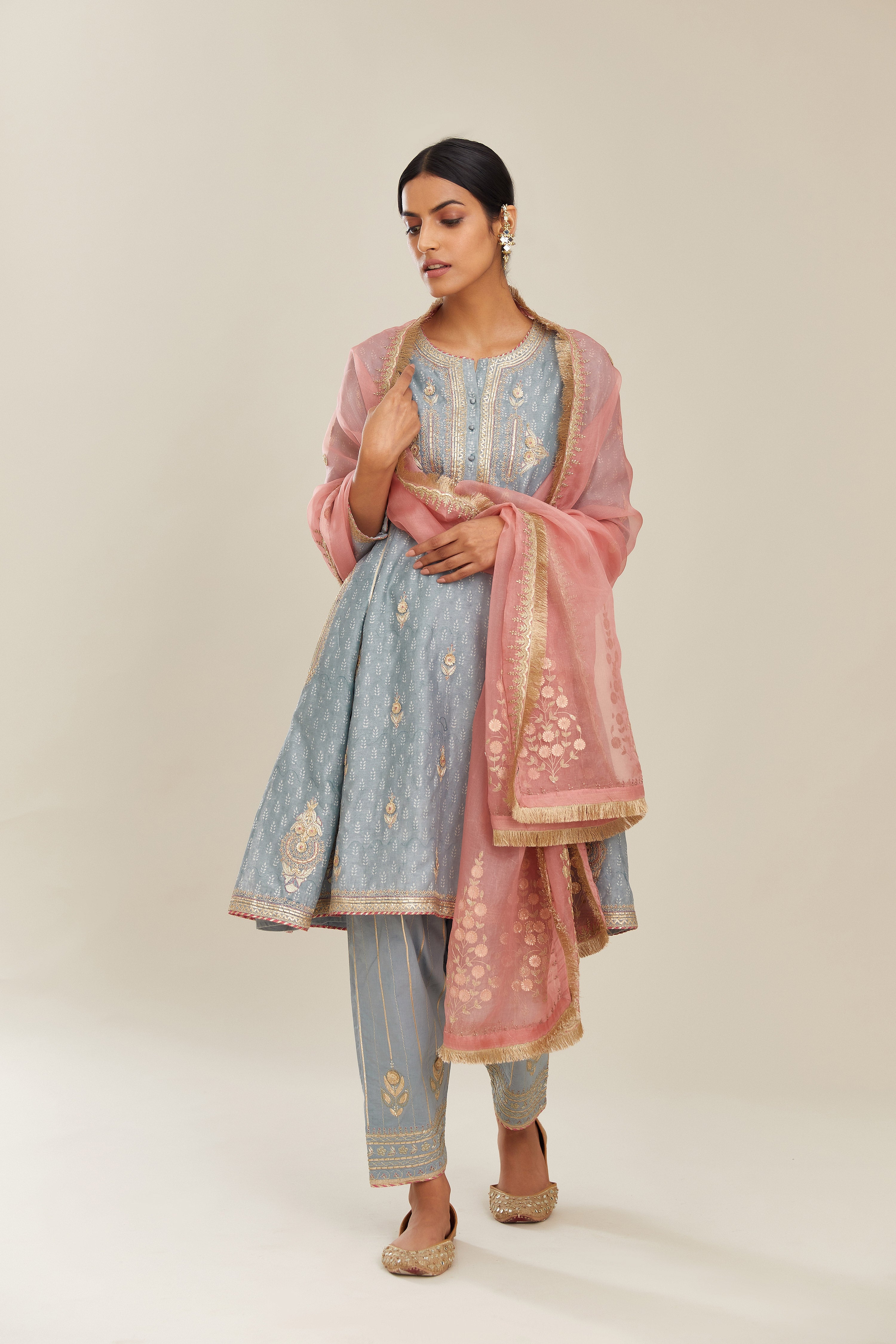 Powder blue hand block printed short kalidar silk chanderi kurta set with button placket and all over gold gota and zari embroidery.