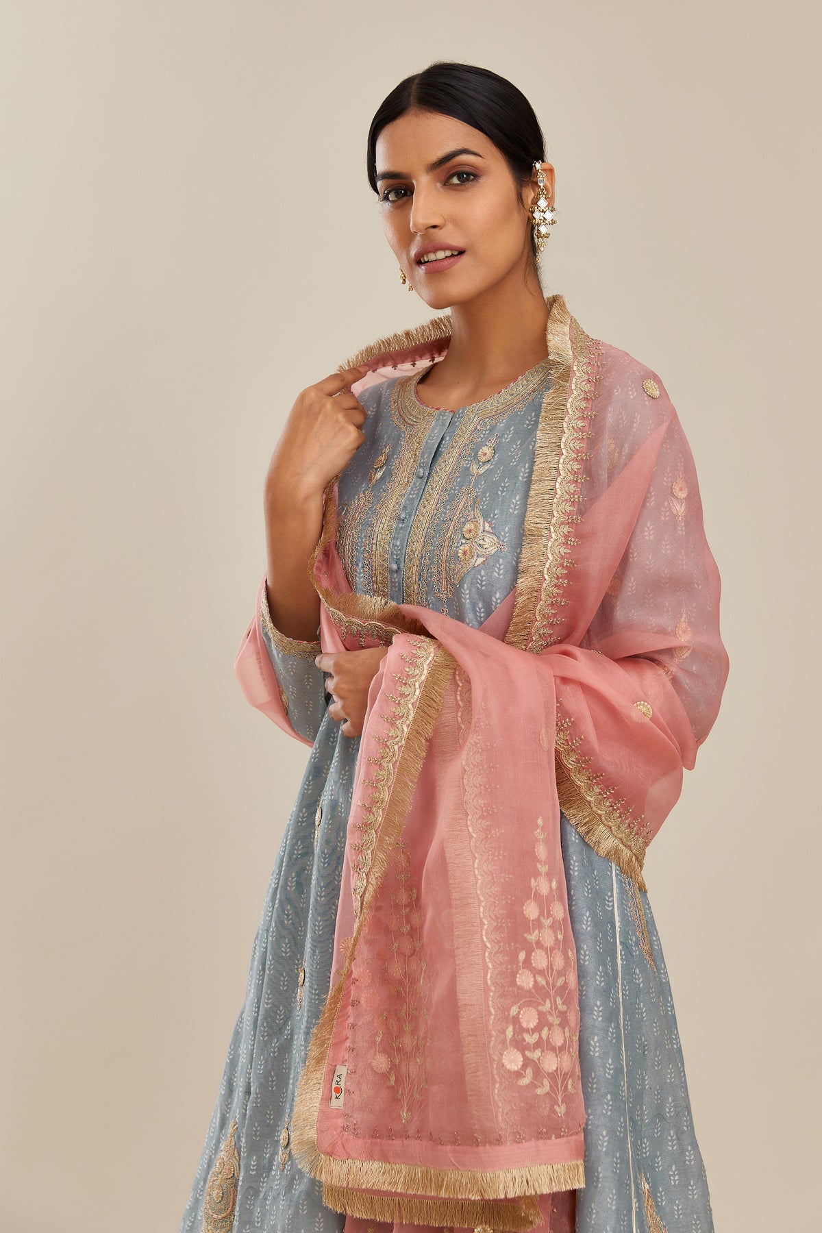 Powder blue hand block printed short kalidar silk chanderi kurta set with button placket and all over gold gota and zari embroidery.