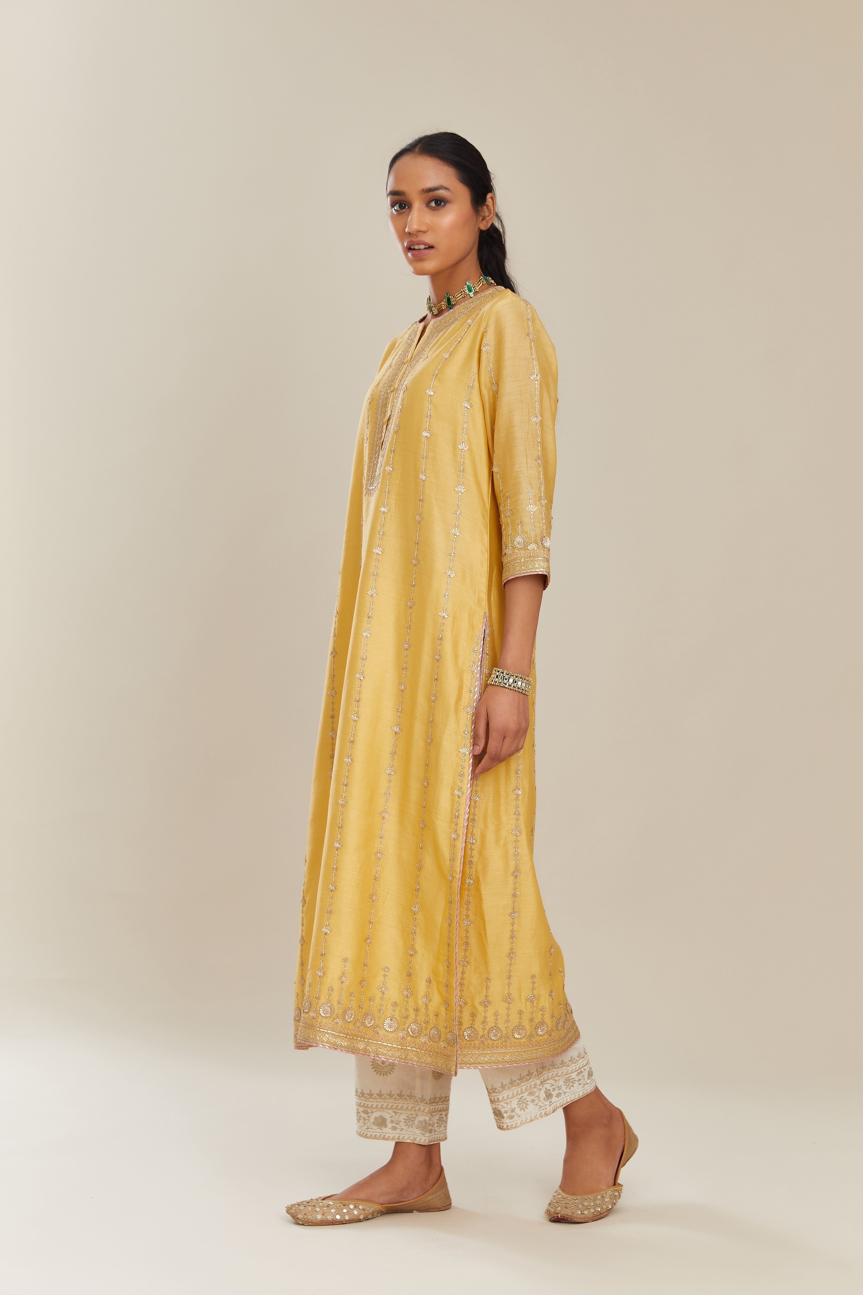 Yellow silk chanderi straight kurta set with all over heavy gold gota and zari embroidery