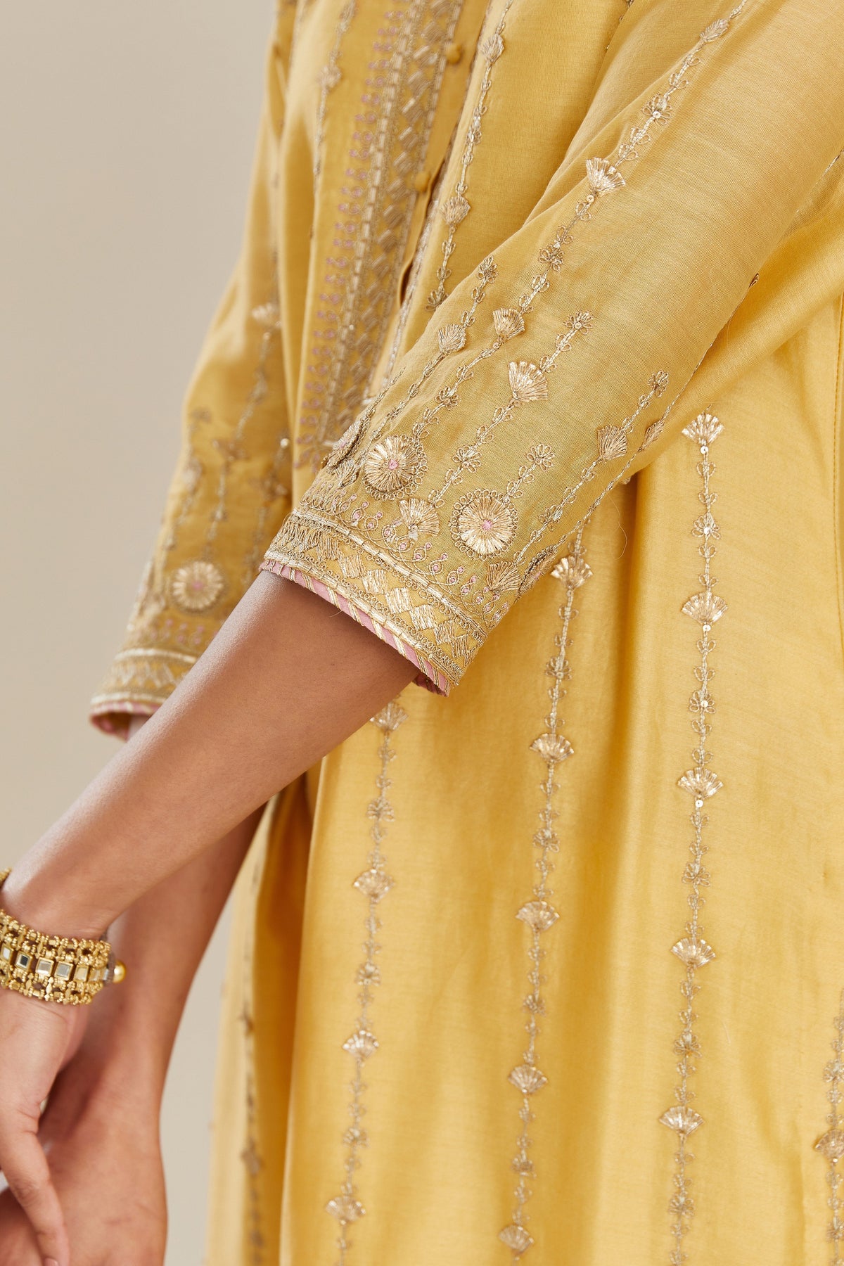 Yellow silk chanderi straight kurta set with all over heavy gold gota and zari embroidery