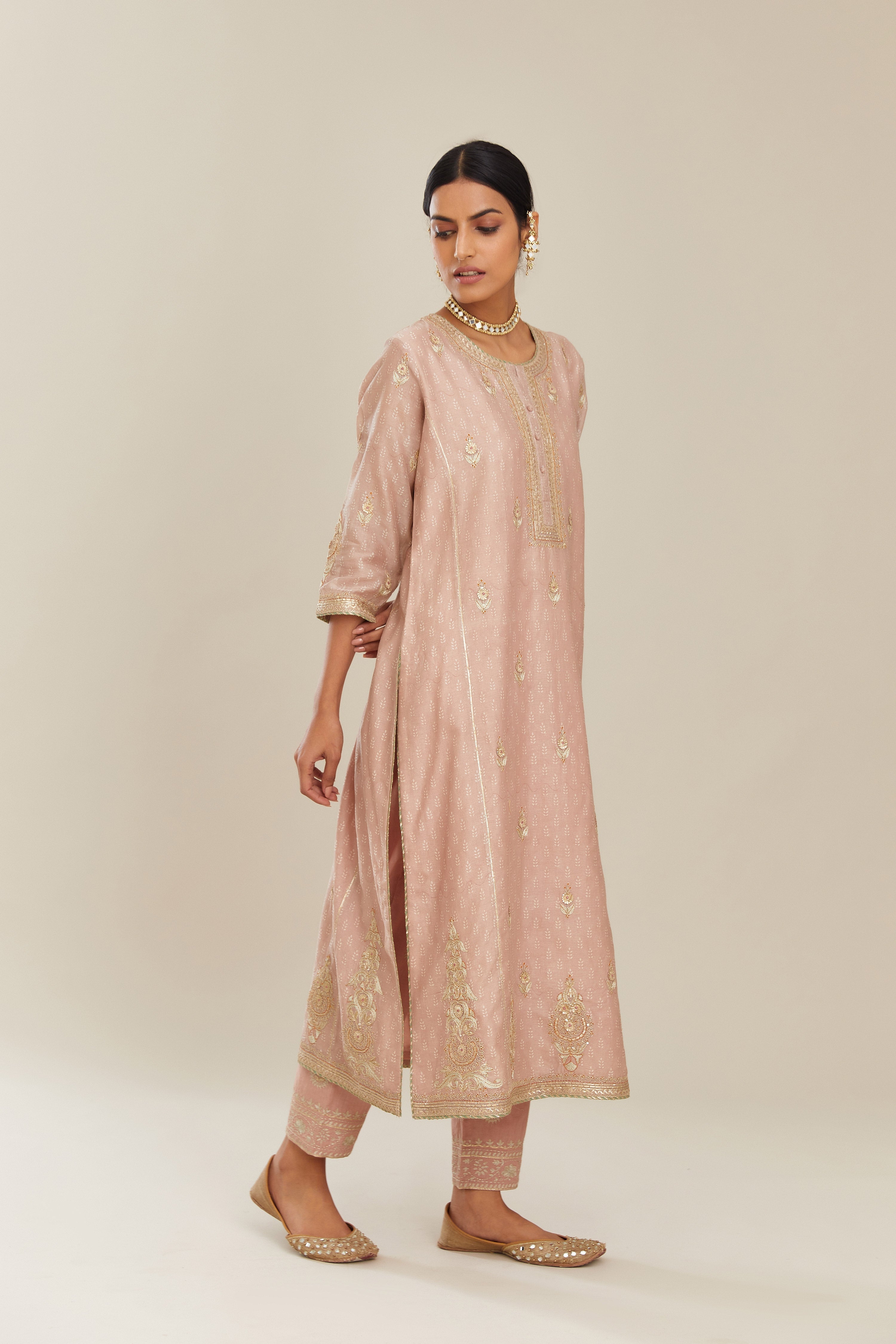 Old rose hand block printed silk chanderi kurta set with side panels, highlighted with gold gota and zari embroidery.