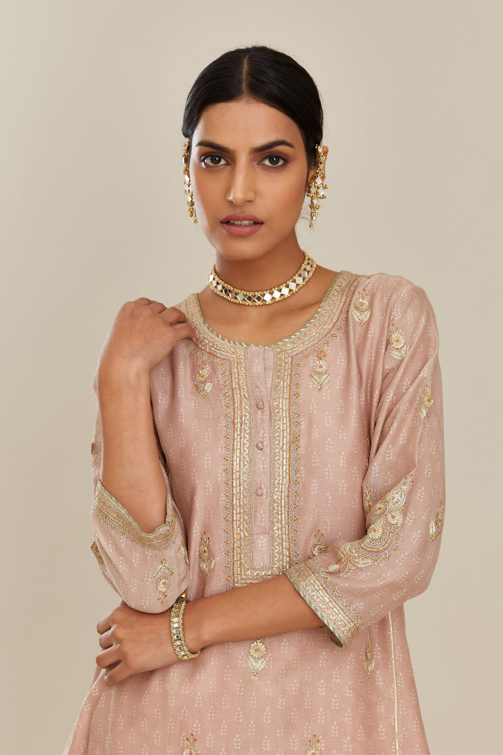 Old rose hand block printed silk chanderi kurta set with side panels, highlighted with gold gota and zari embroidery.