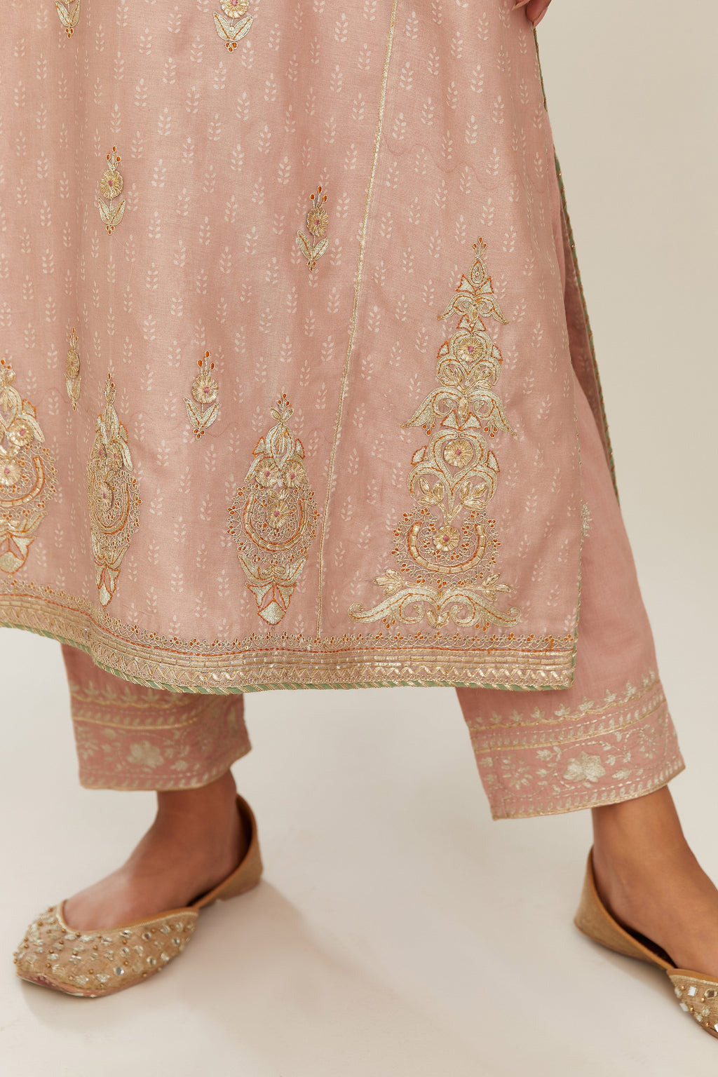 Old rose hand block printed silk chanderi kurta set with side panels, highlighted with gold gota and zari embroidery.