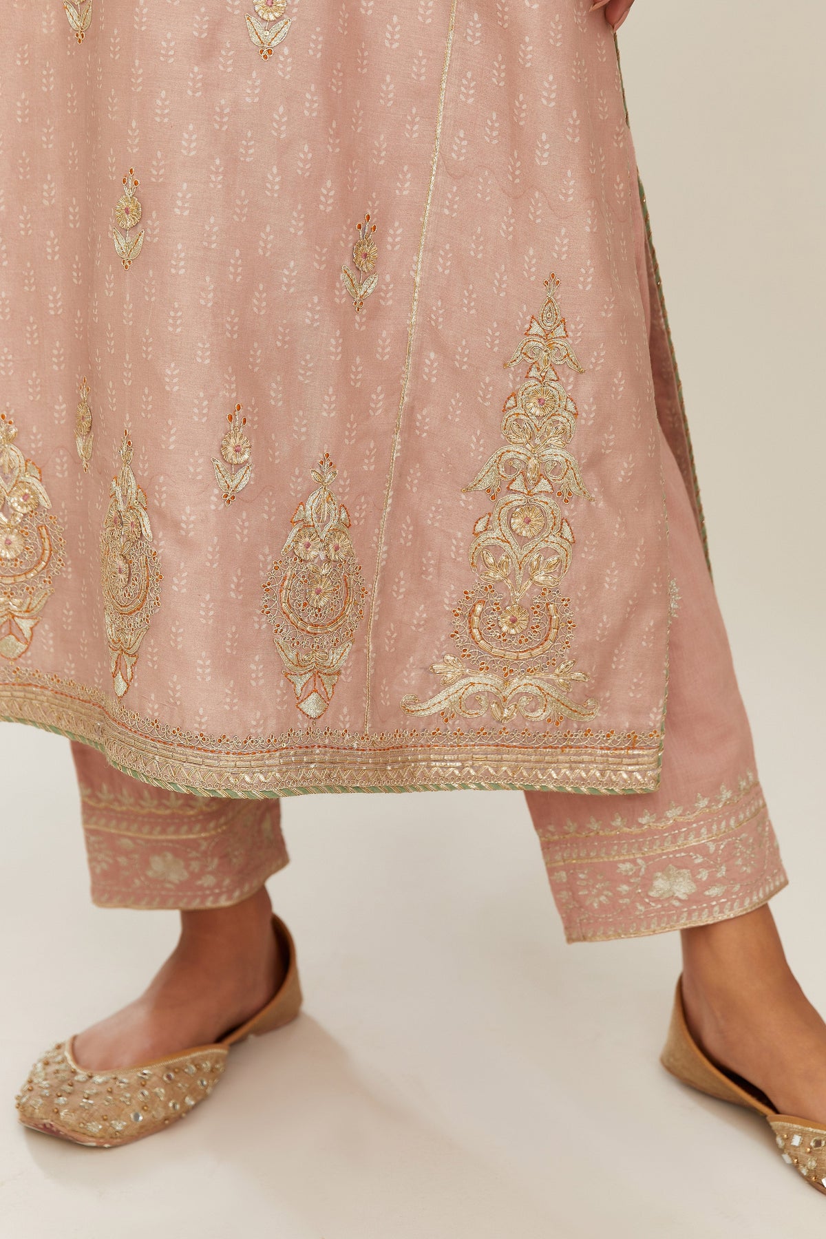 Old rose hand block printed silk chanderi kurta set with side panels, highlighted with gold gota and zari embroidery.