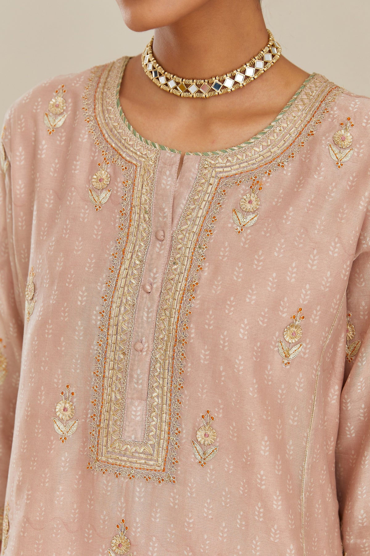 Old rose hand block printed silk chanderi kurta set with side panels, highlighted with gold gota and zari embroidery.