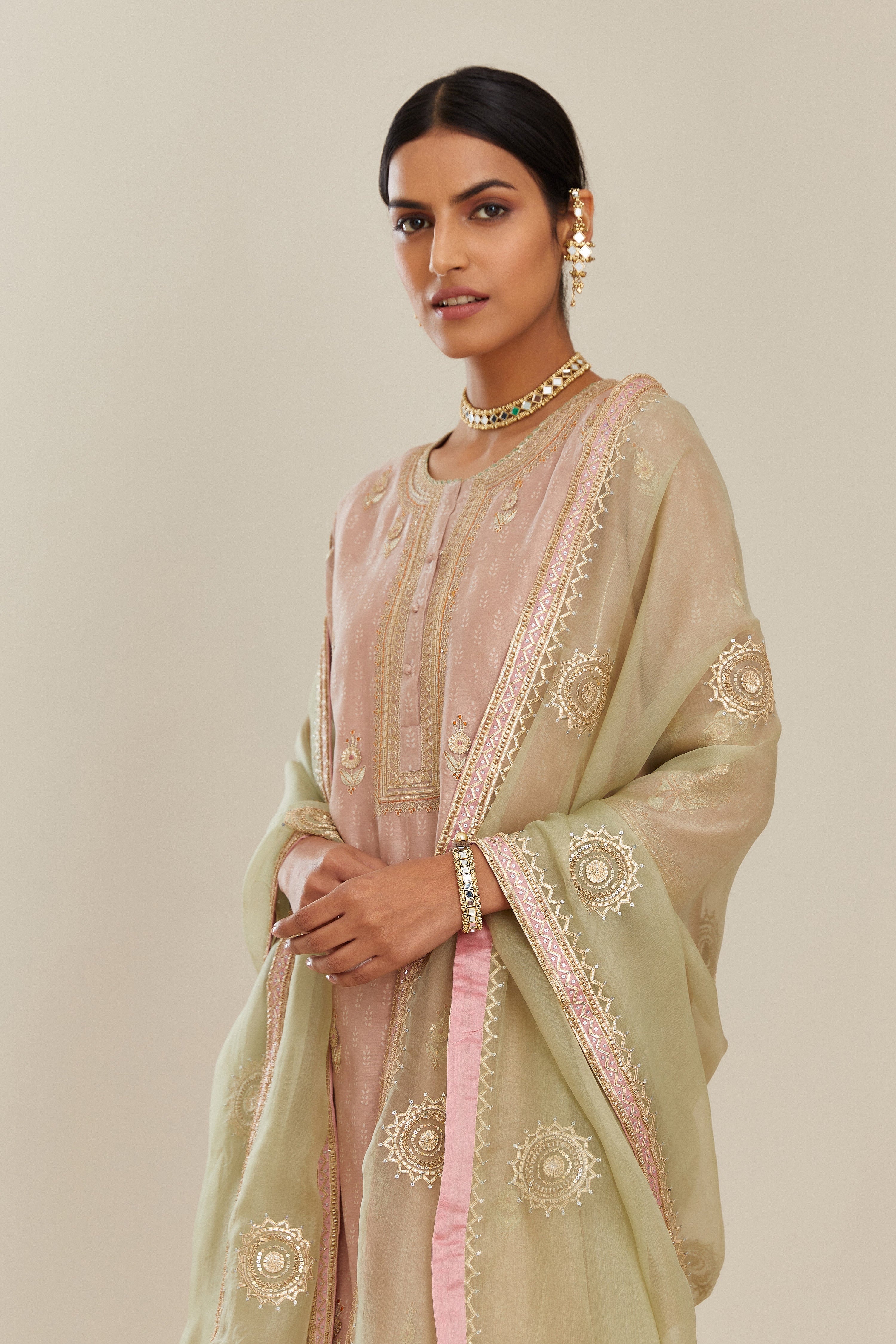 Sage green silk organza dupatta with delicate gold gota embroidery and contrast colored border running along all edges.