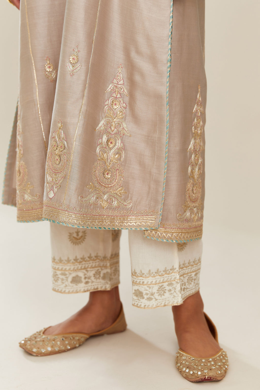 Grey silk chanderi kurta set with side panels, highlighted with gold gota and zari embroidery.