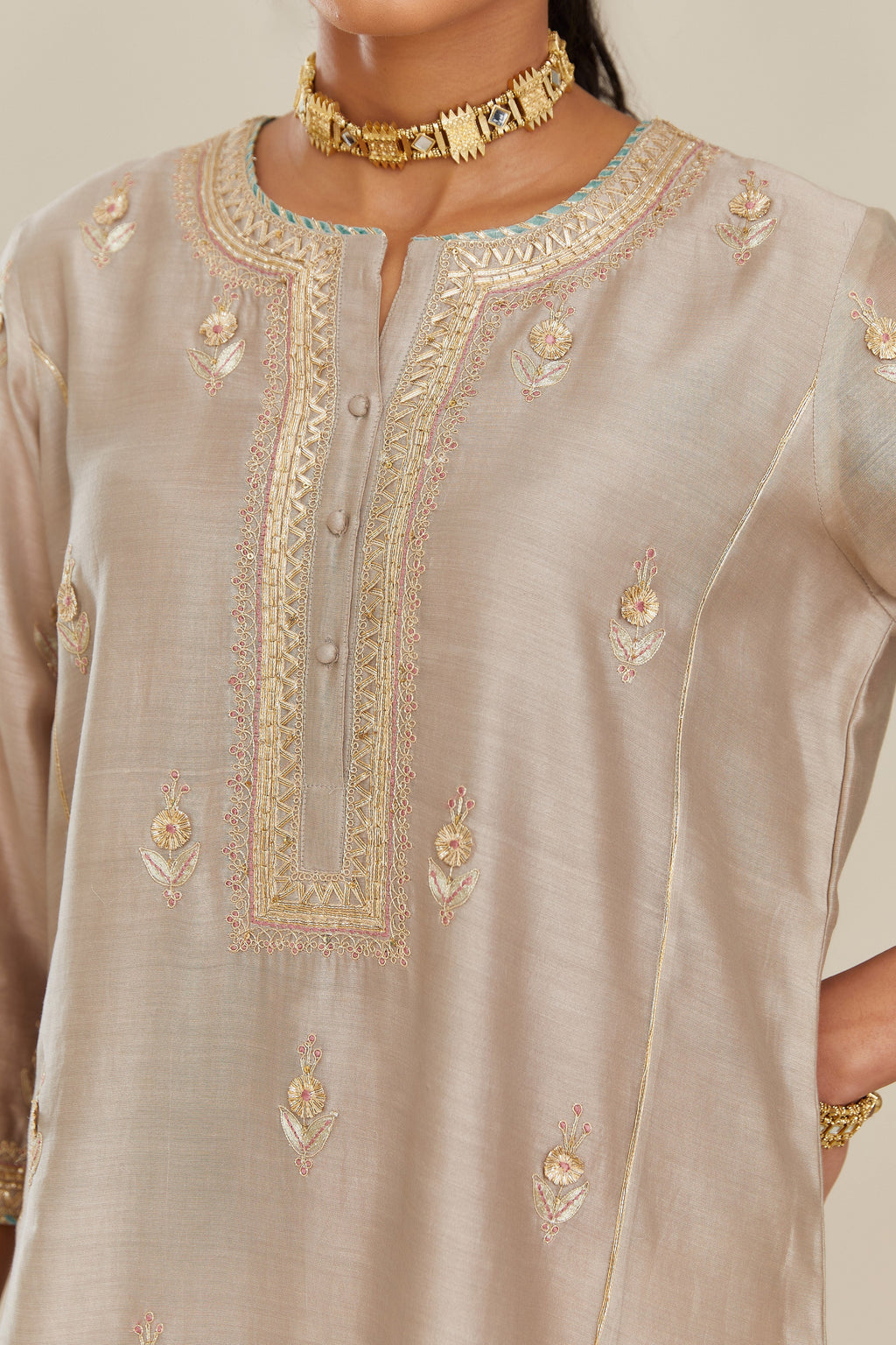 Grey silk chanderi kurta set with side panels, highlighted with gold gota and zari embroidery.