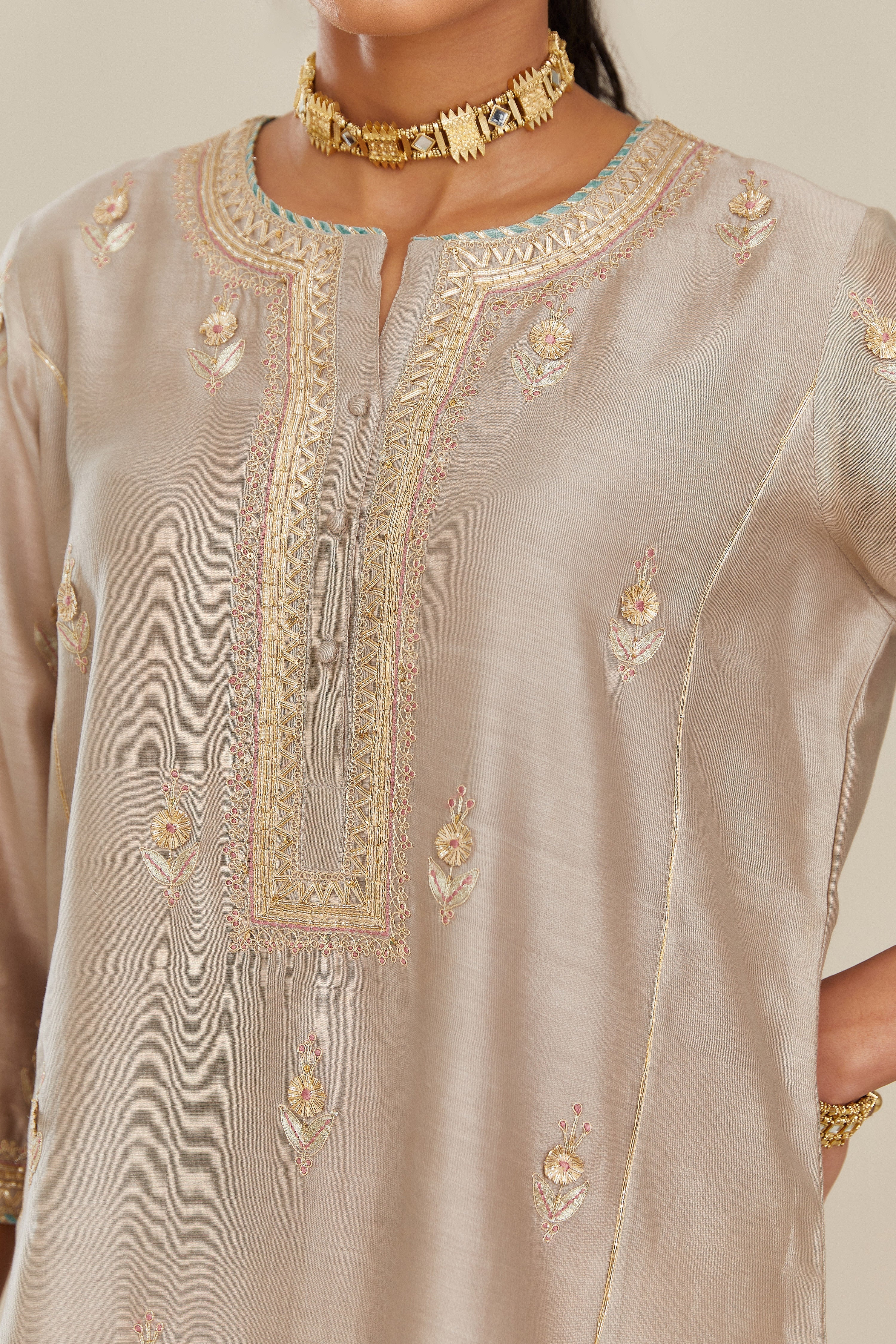 Grey silk chanderi kurta set with side panels, highlighted with gold gota and zari embroidery.
