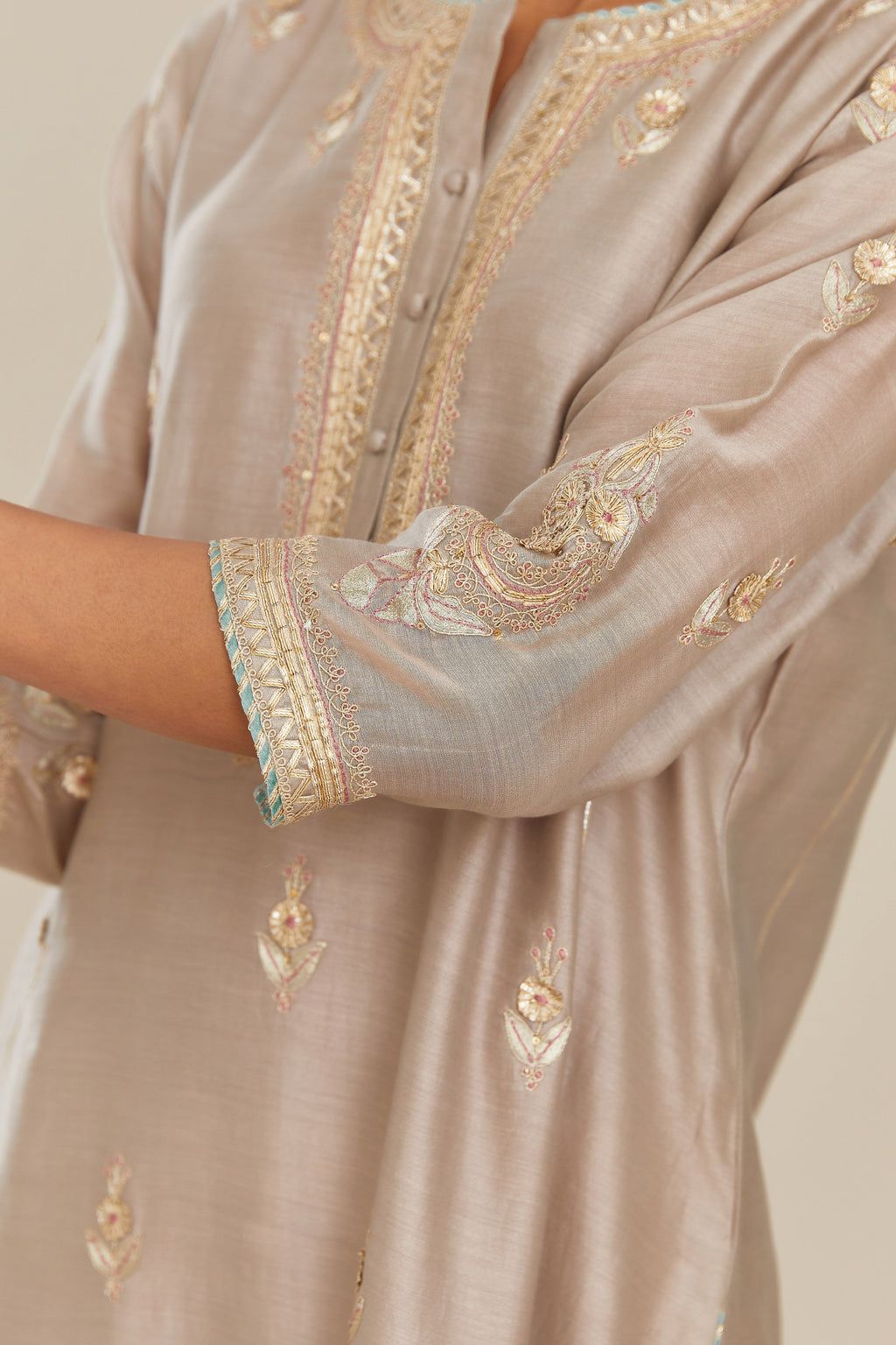 Grey silk chanderi kurta set with side panels, highlighted with gold gota and zari embroidery.