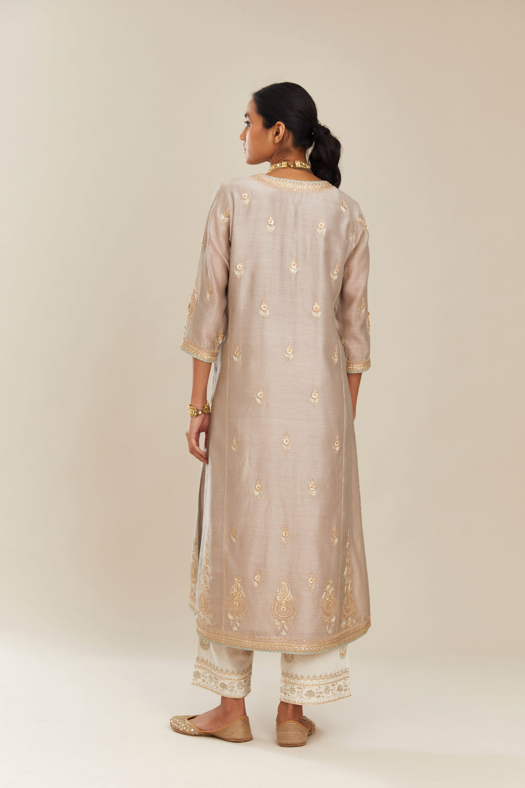 Grey silk chanderi kurta set with side panels, highlighted with gold gota and zari embroidery.