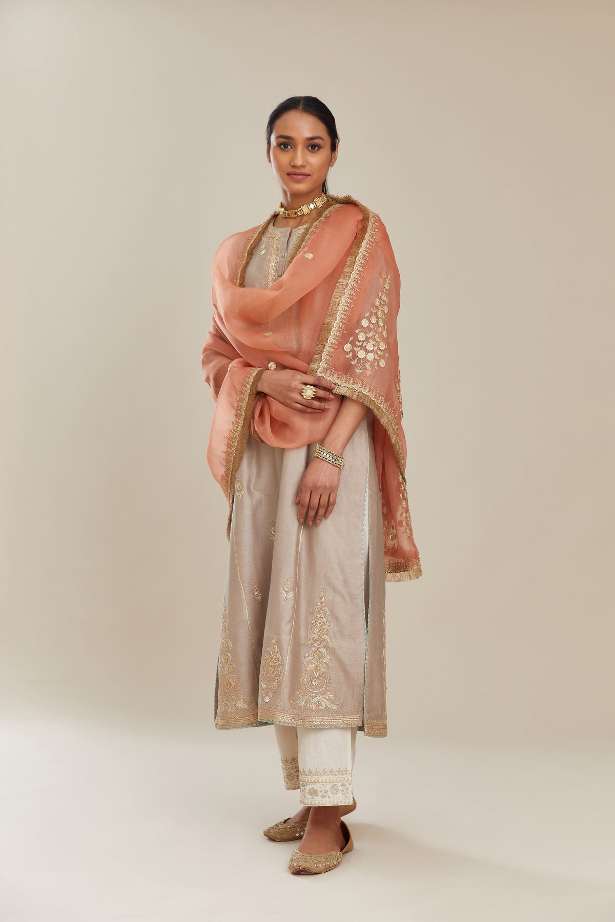 Coral peach silk organza dupatta with delicate gold zari and gota embroidery border running along all edges.