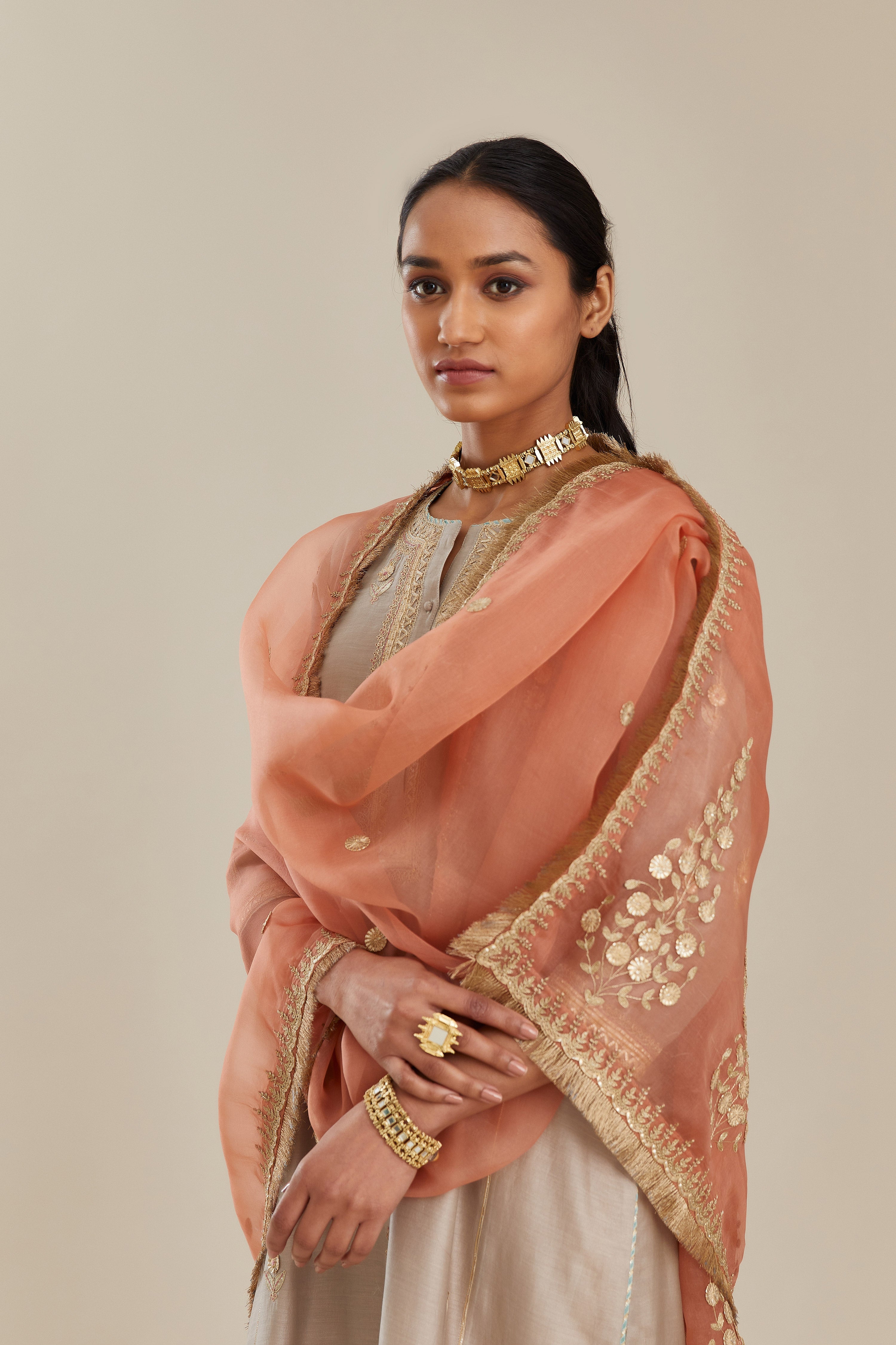 Coral peach silk organza dupatta with delicate gold zari and gota embroidery border running along all edges.