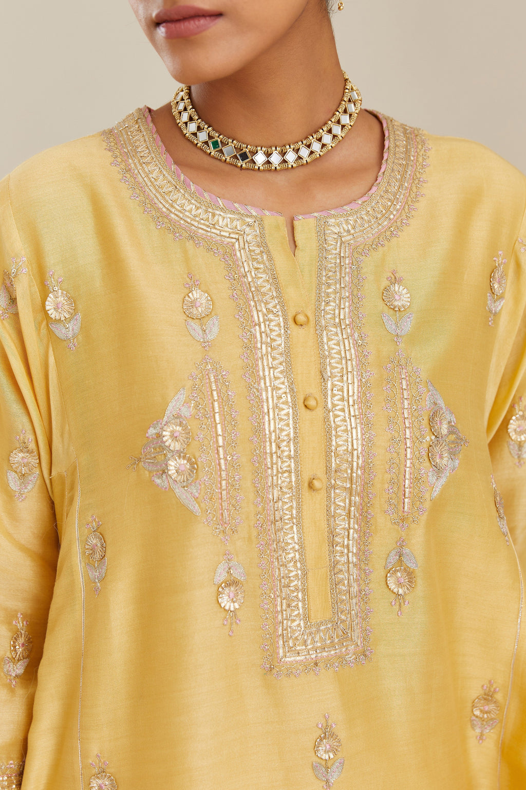 Yellow short kalidar silk chanderi kurta set with button placket and all over gold gota and zari embroidery.