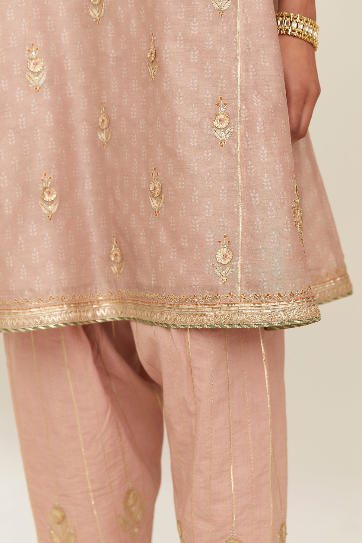 Old rose blue hand block printed short kalidar silk chanderi kurta set with button placket and all over gold gota and zari embroidery.