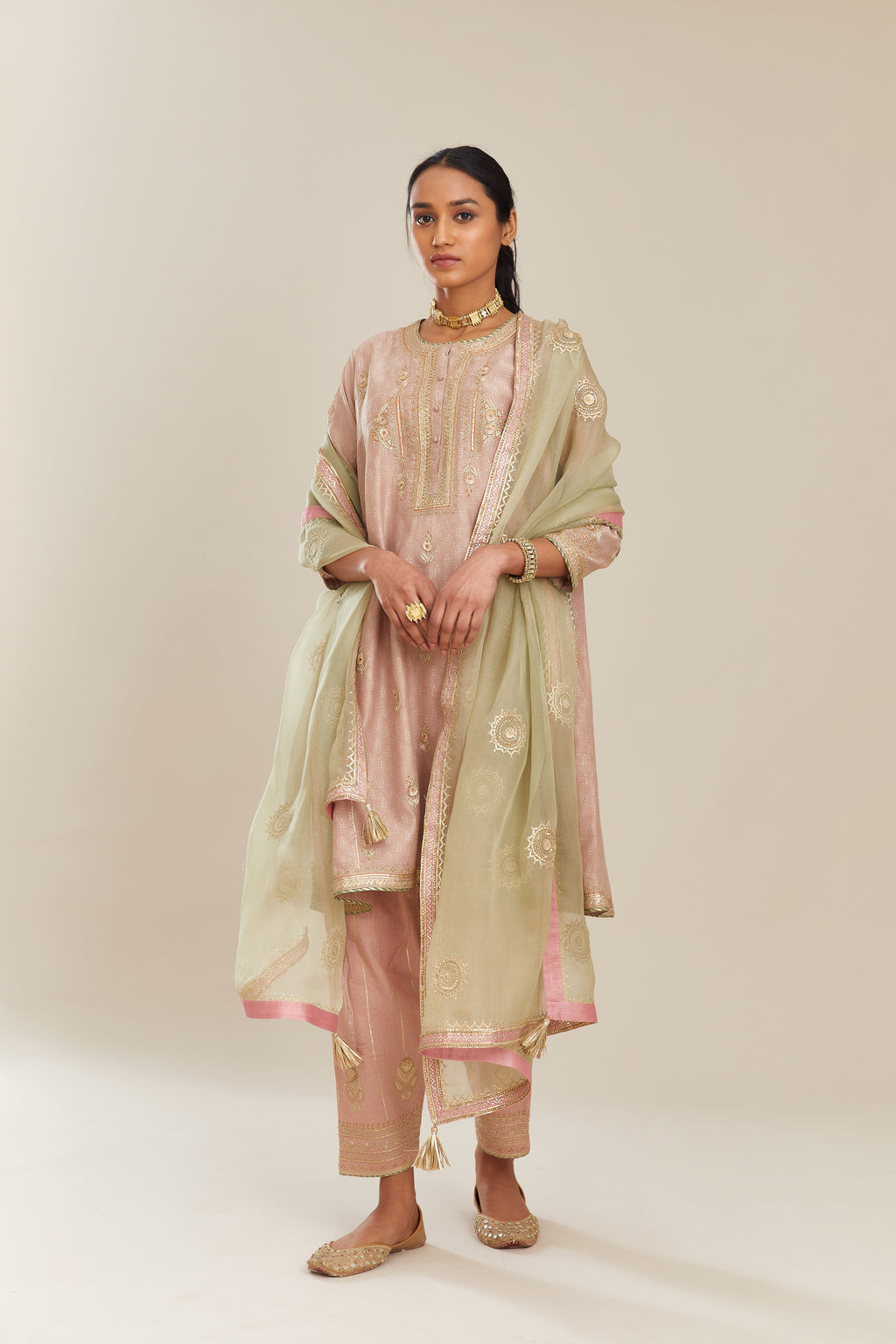 Sage green silk organza dupatta with delicate gold gota embroidery and contrast colored border running along all edges.