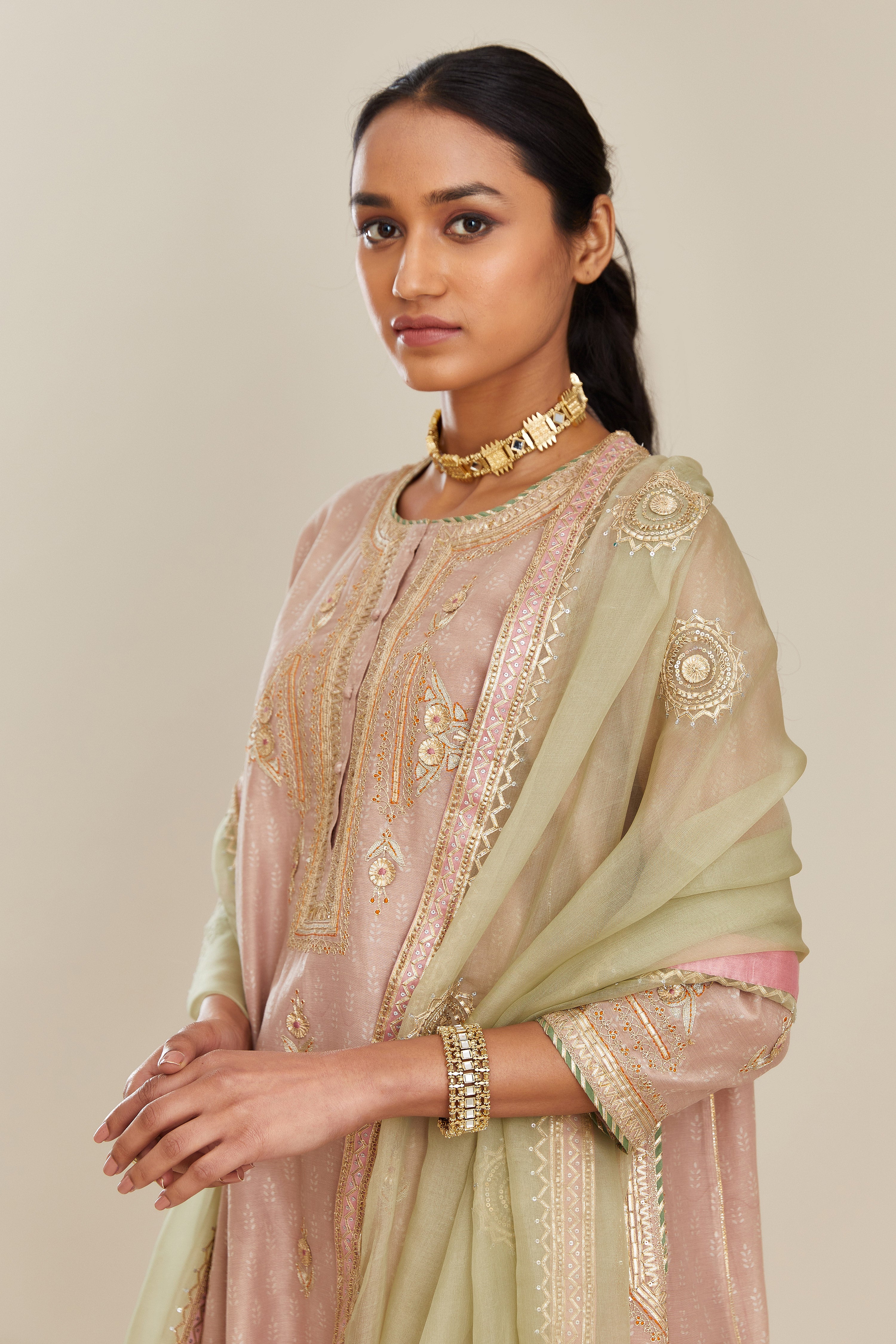 Sage green silk organza dupatta with delicate gold gota embroidery and contrast colored border running along all edges.