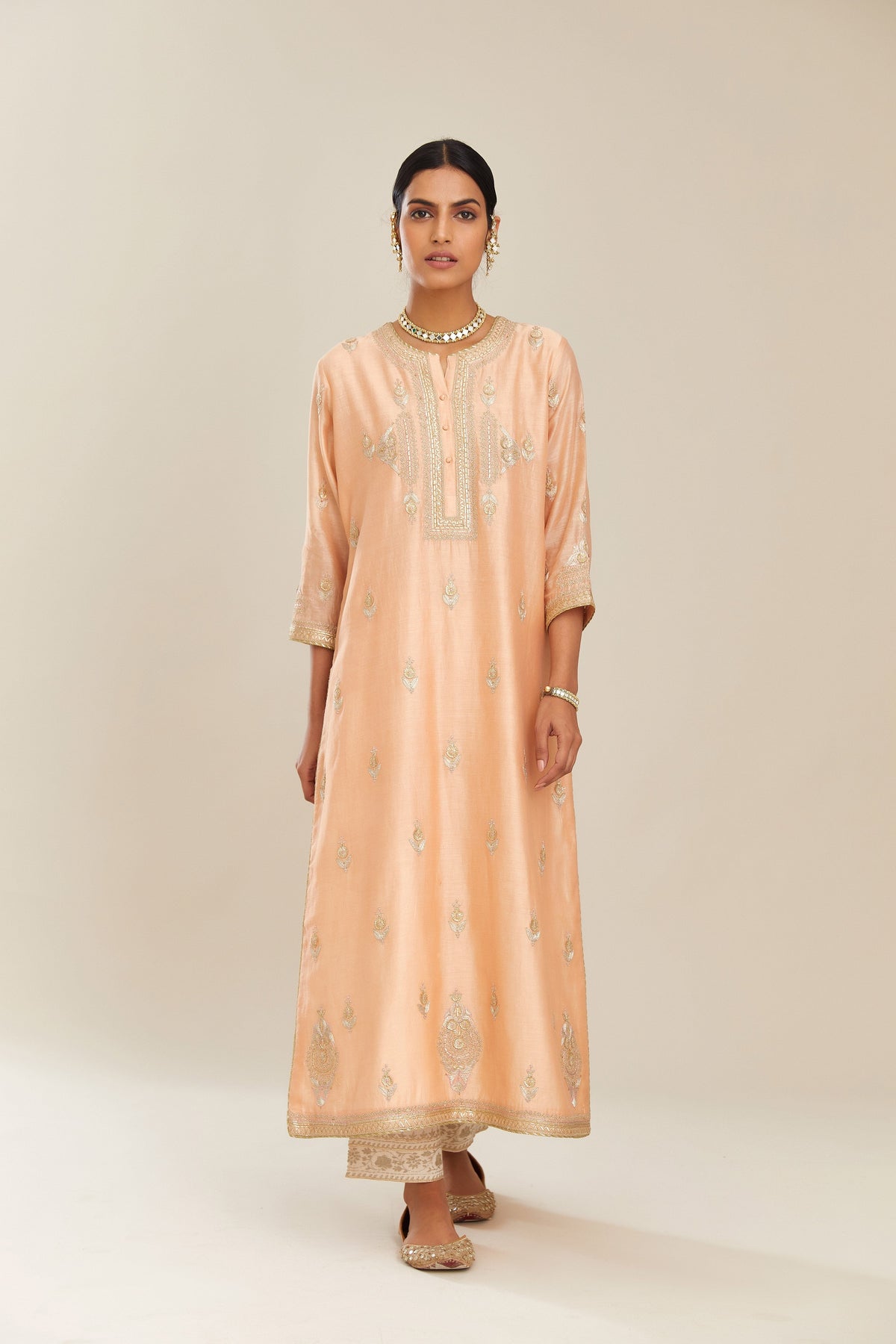 Peach silk chanderi straight kurta set with gold gota and zari embroidery.