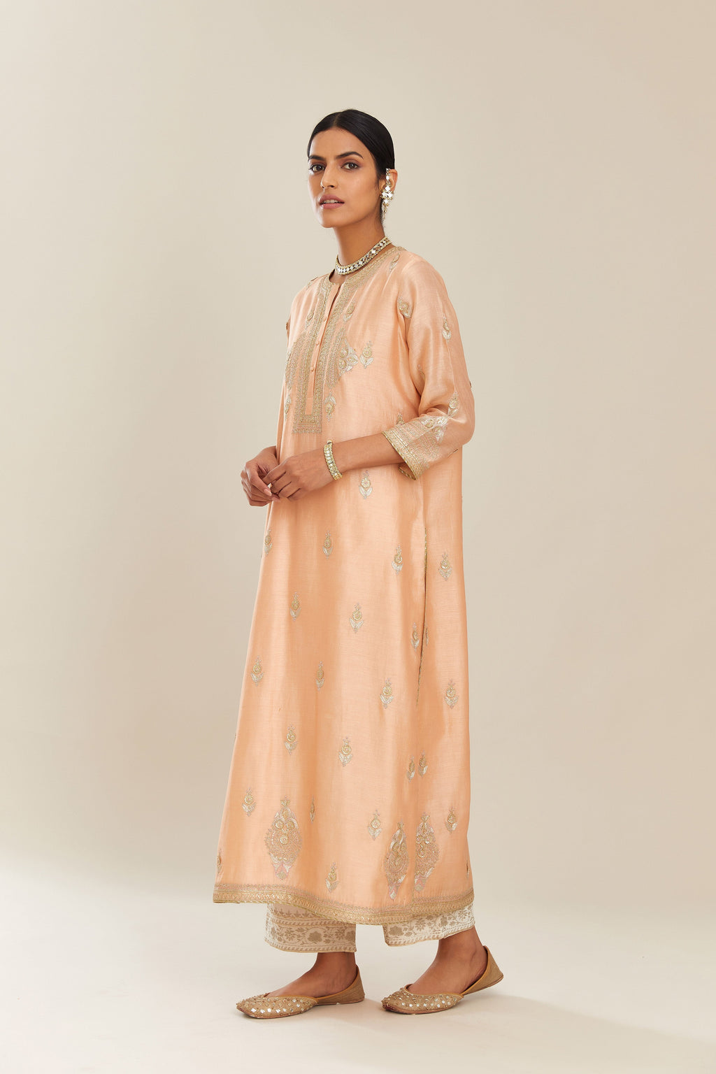 Peach silk chanderi straight kurta set with gold gota and zari embroidery.