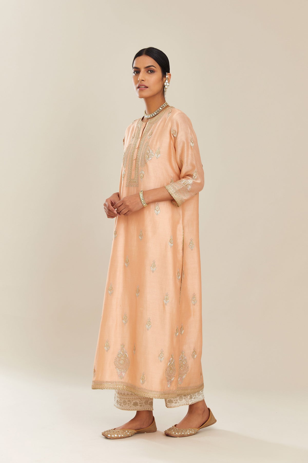 Peach silk chanderi straight kurta set with gold gota and zari embroidery.