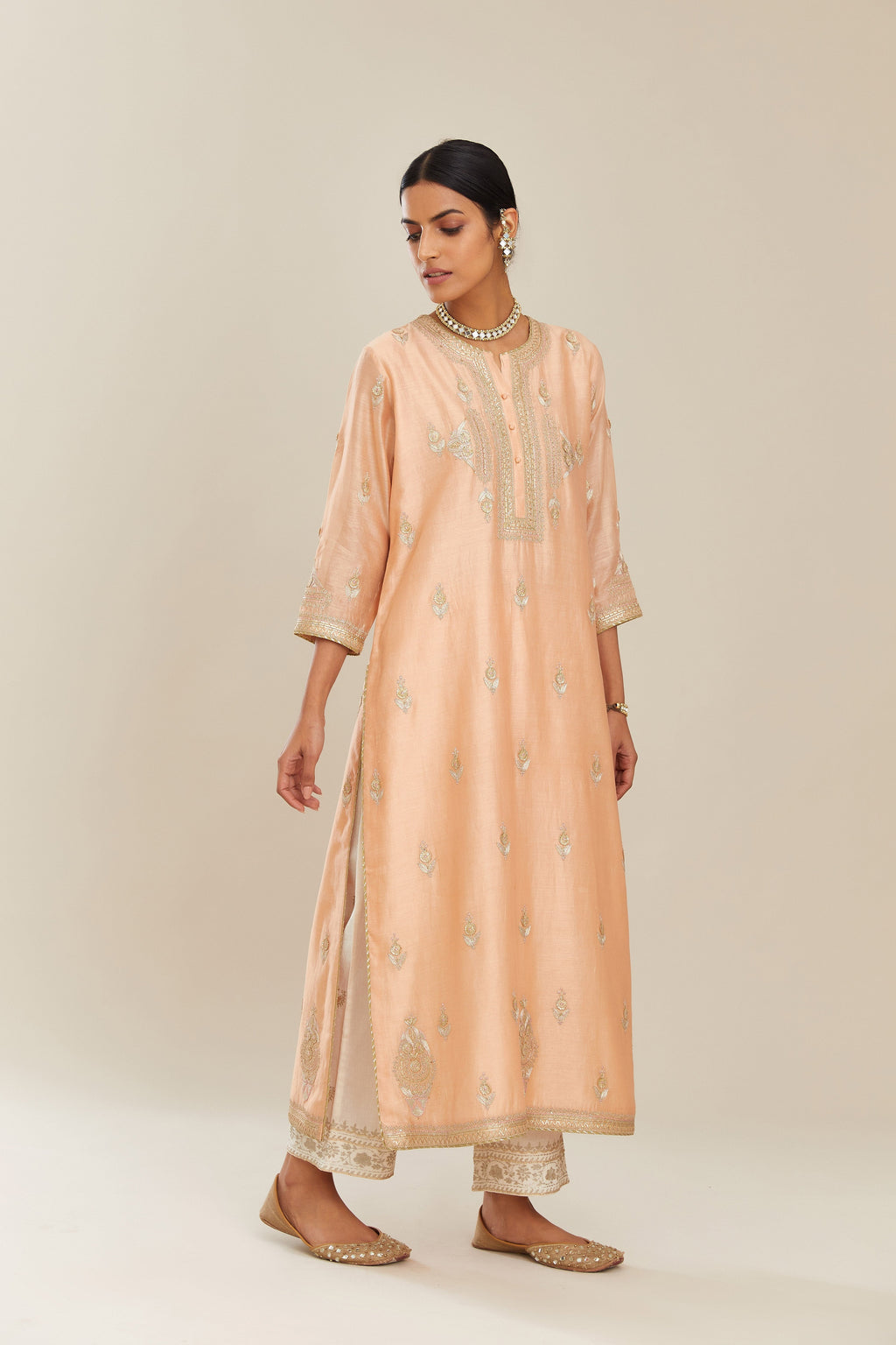Peach silk chanderi straight kurta set with gold gota and zari embroidery.