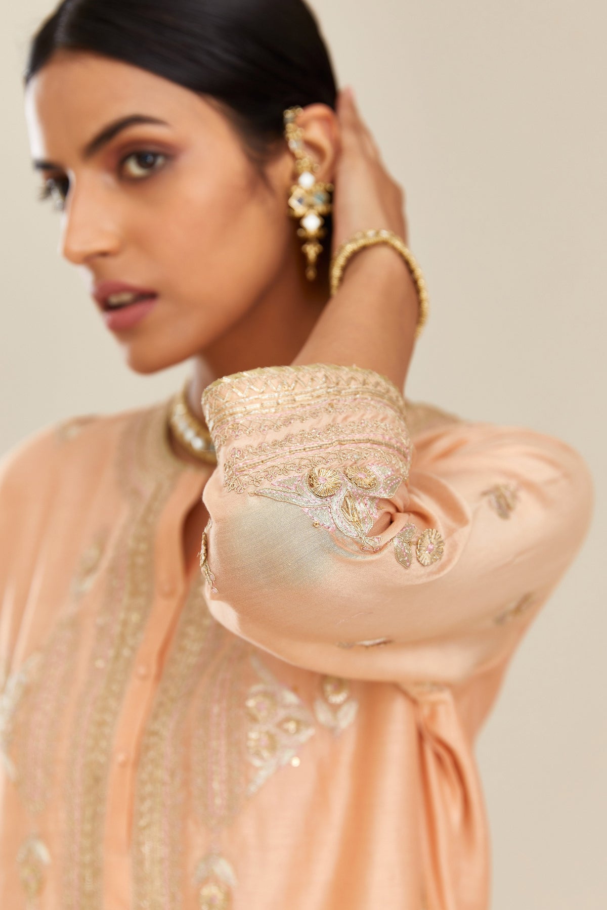 Peach silk chanderi straight kurta set with gold gota and zari embroidery.