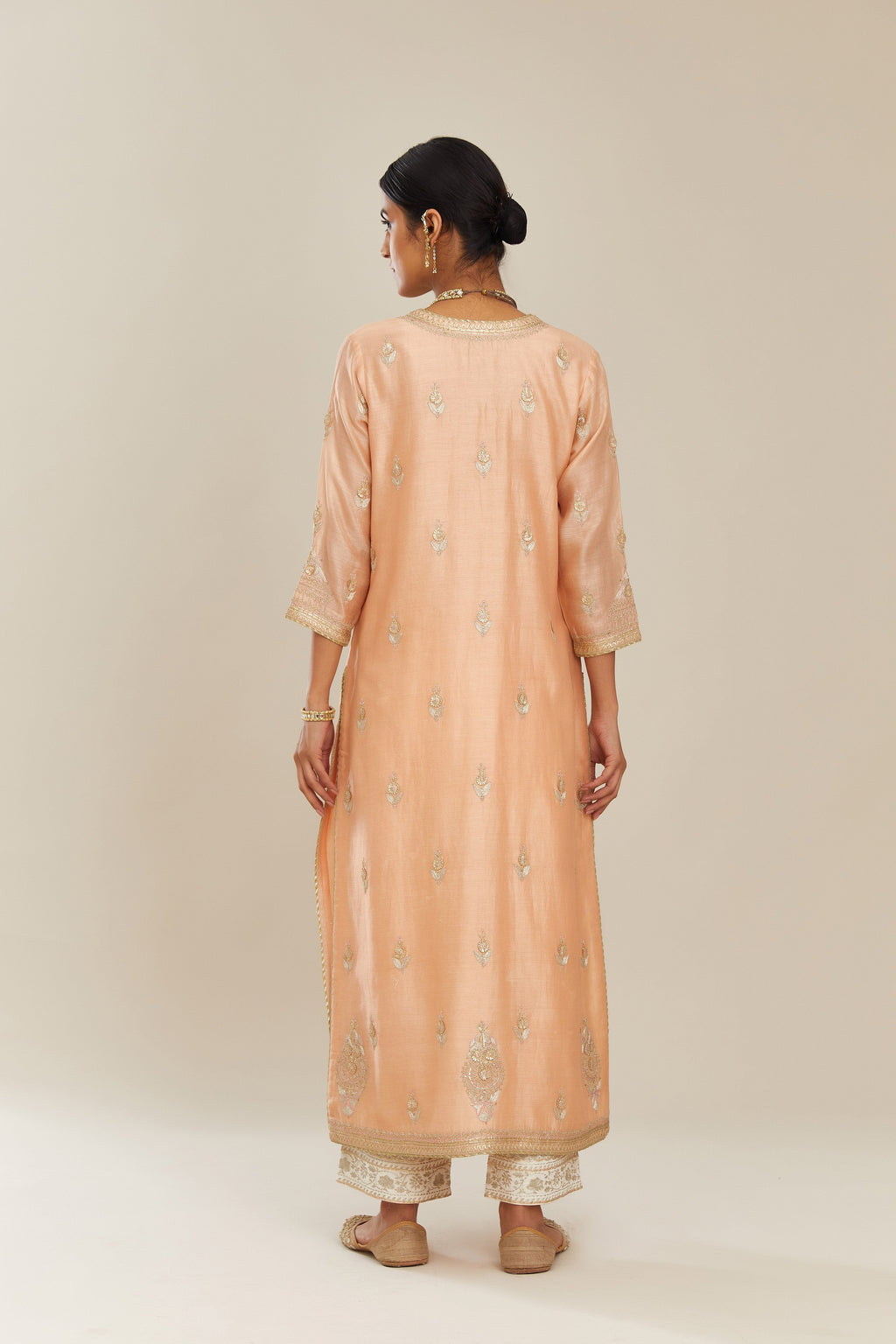Peach silk chanderi straight kurta set with gold gota and zari embroidery.