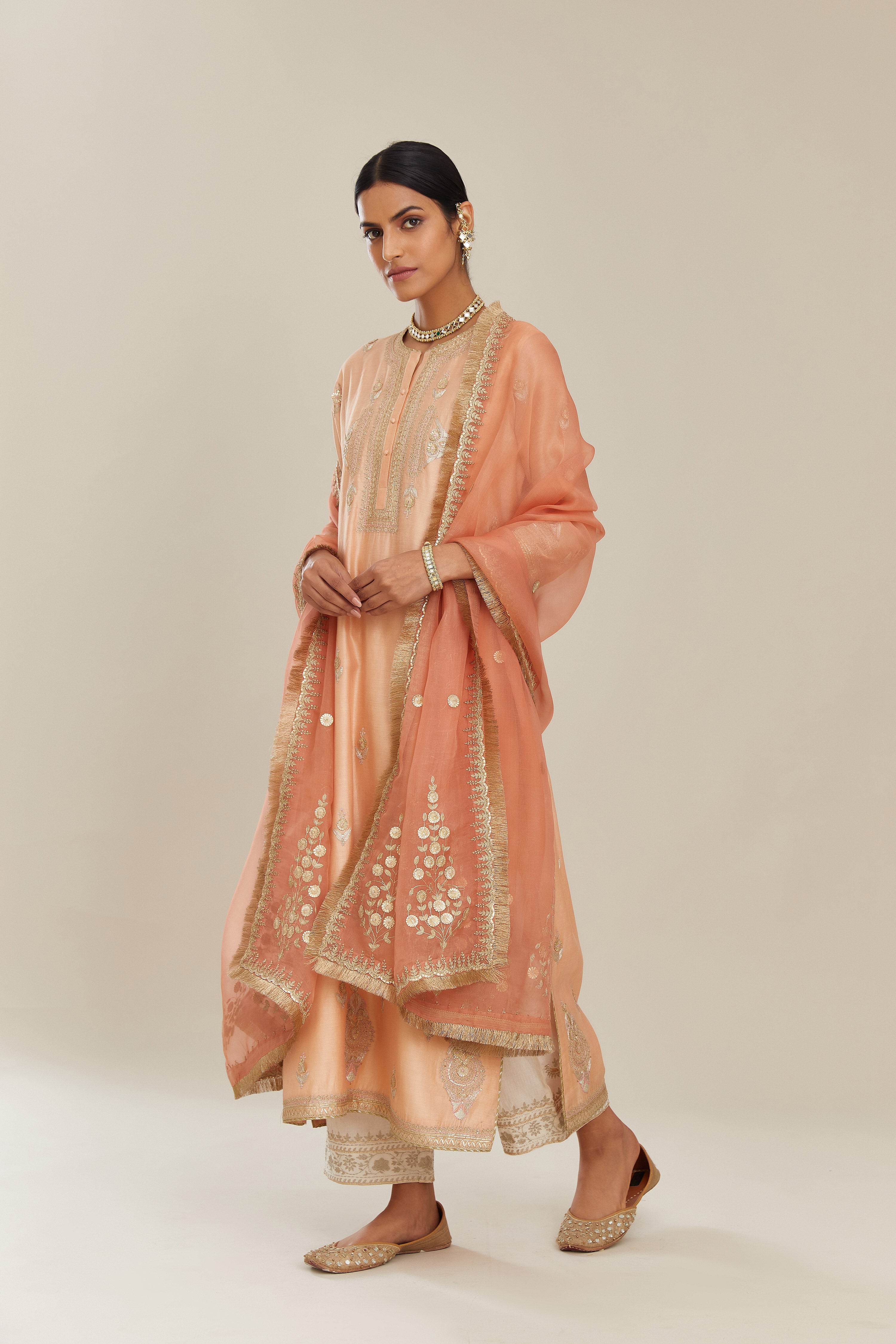 Peach silk chanderi straight kurta set with gold gota and zari embroidery.