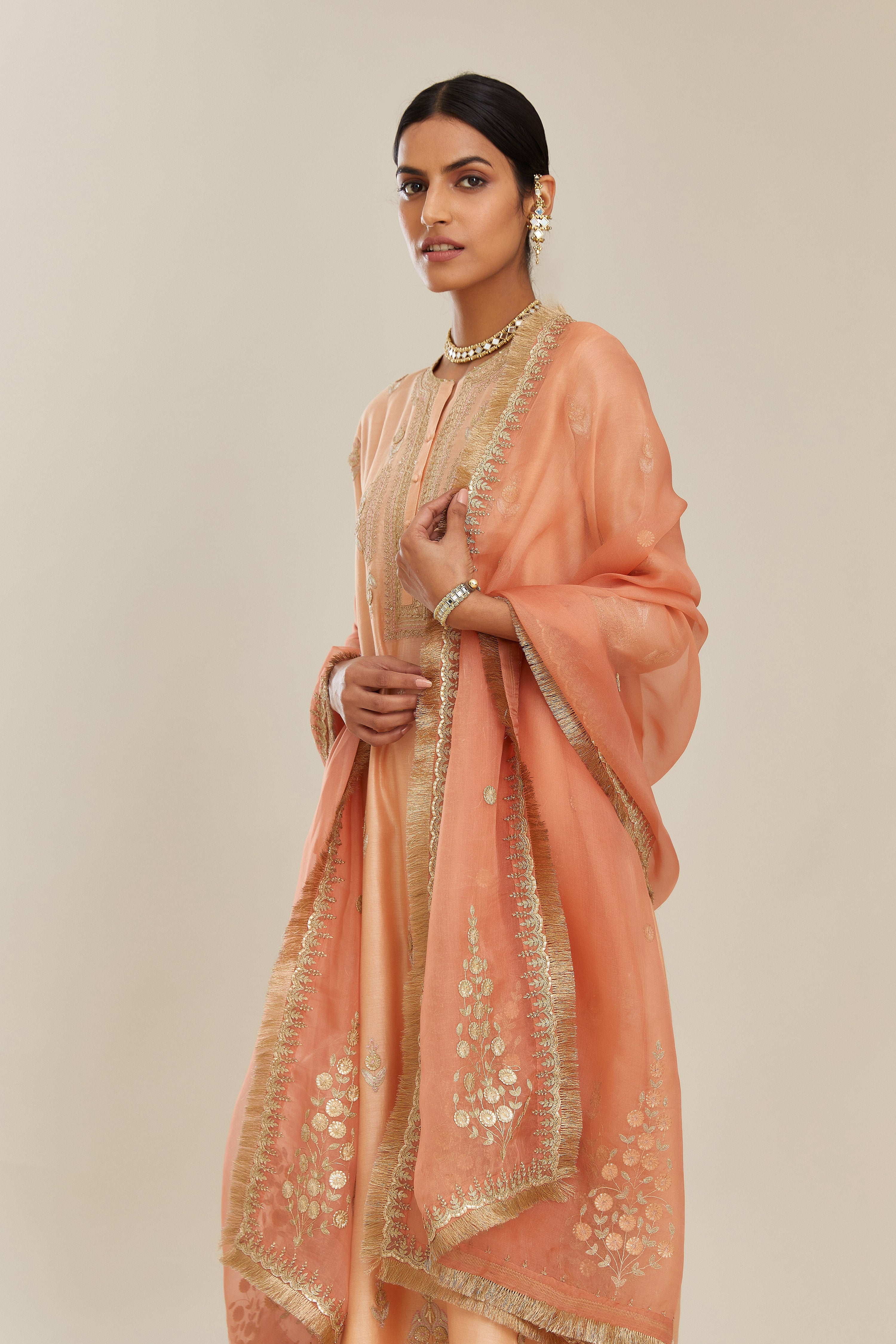 Coral peach silk organza dupatta with delicate gold zari and gota embroidery border running along all edges.