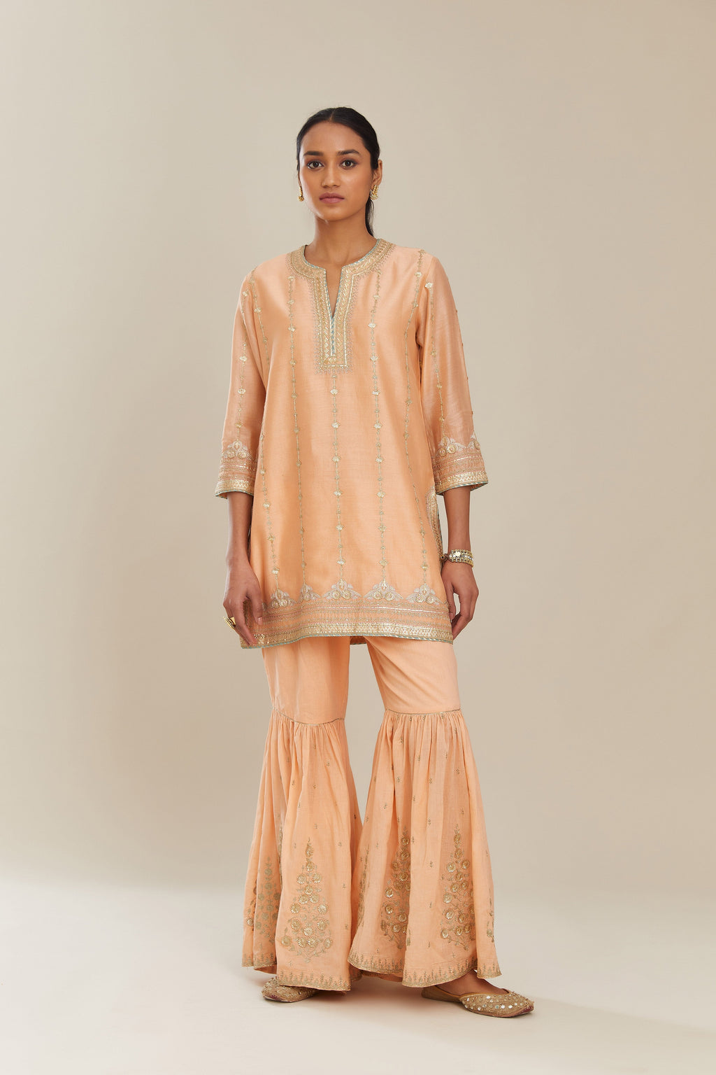 Peach silk chanderi short kurta set with all over heavy gold gota and zari embroidery