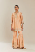 Peach silk chanderi short kurta set with all over heavy gold gota and zari embroidery