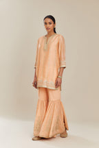 Peach silk chanderi short kurta set with all over heavy gold gota and zari embroidery