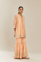 Peach silk chanderi short kurta set with all over heavy gold gota and zari embroidery