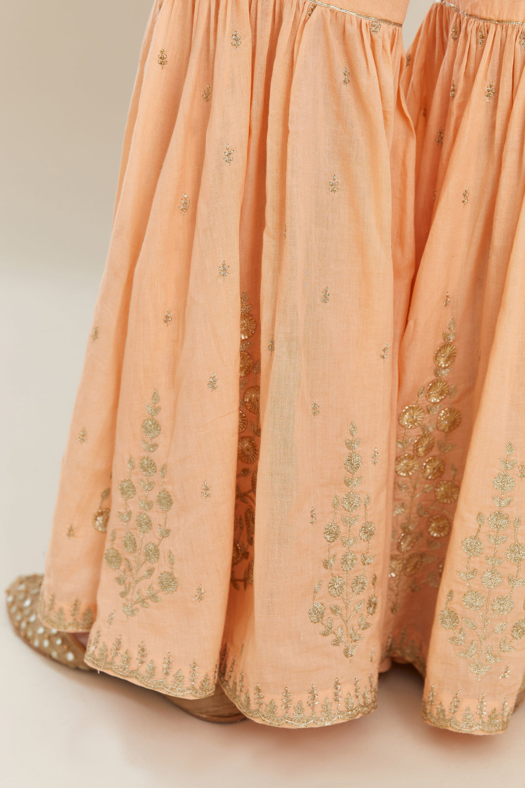 Peach silk chanderi short kurta set with all over heavy gold gota and zari embroidery