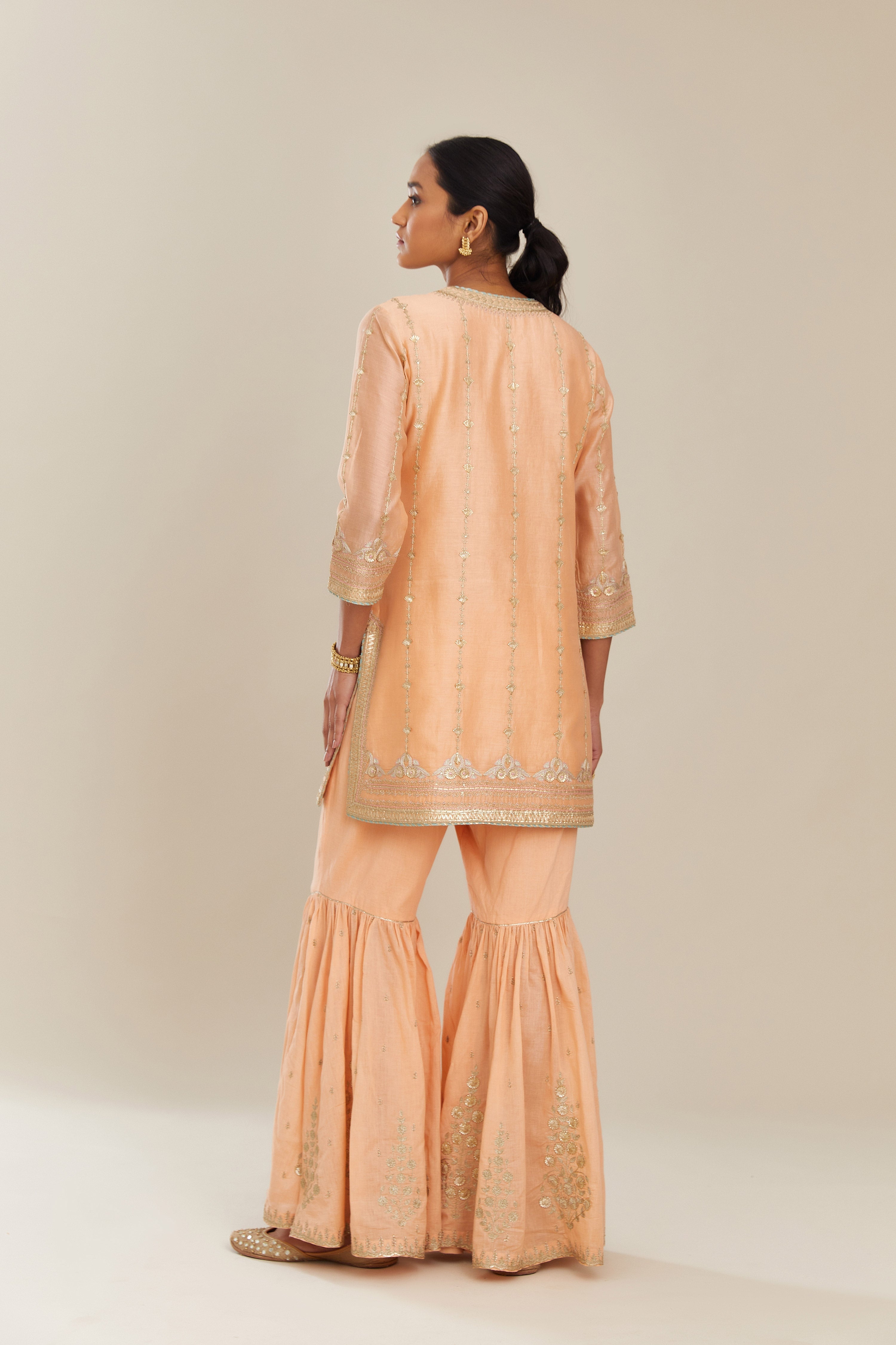 Peach silk chanderi short kurta set with all over heavy gold gota and zari embroidery