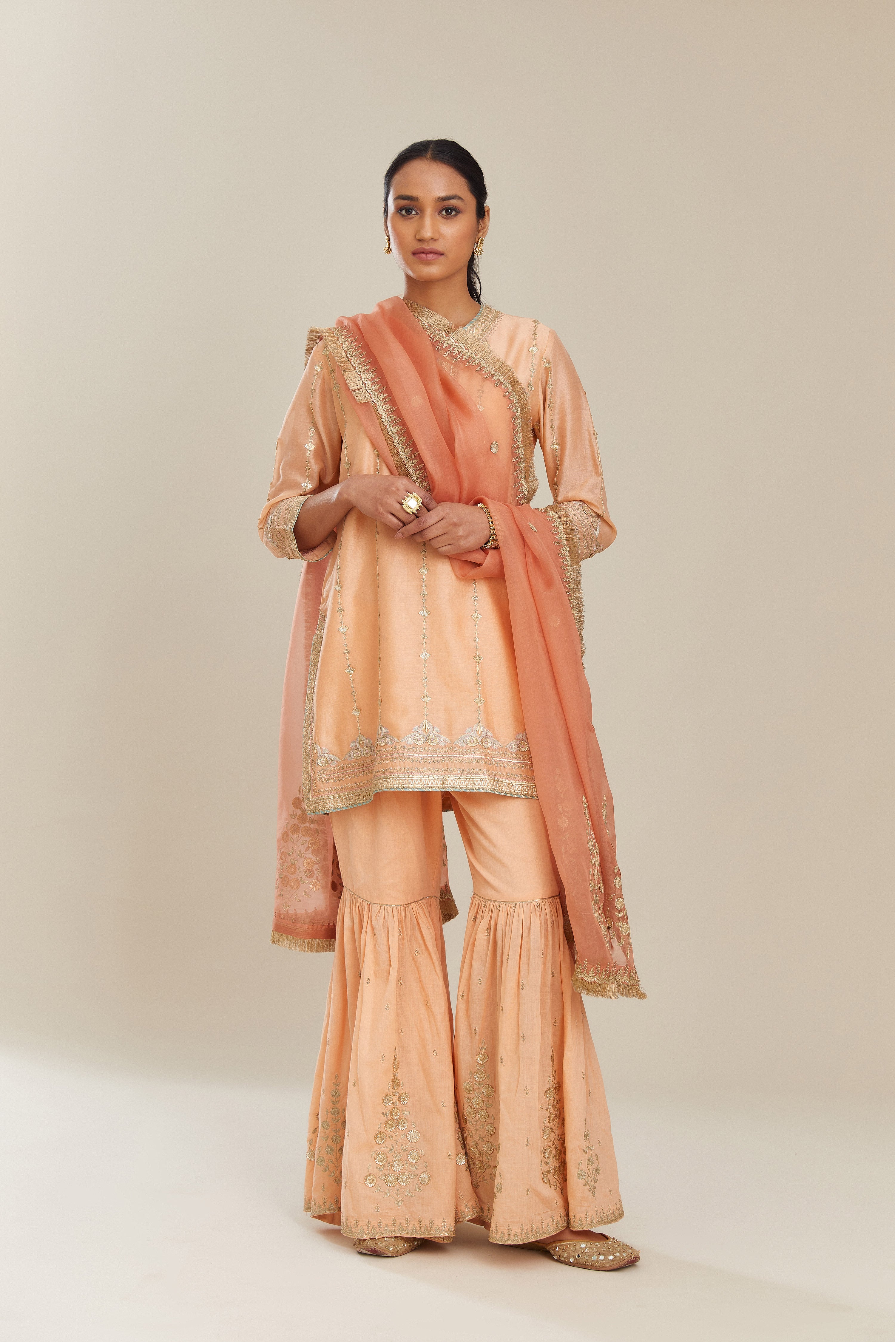 Peach silk chanderi short kurta set with all over heavy gold gota and zari embroidery