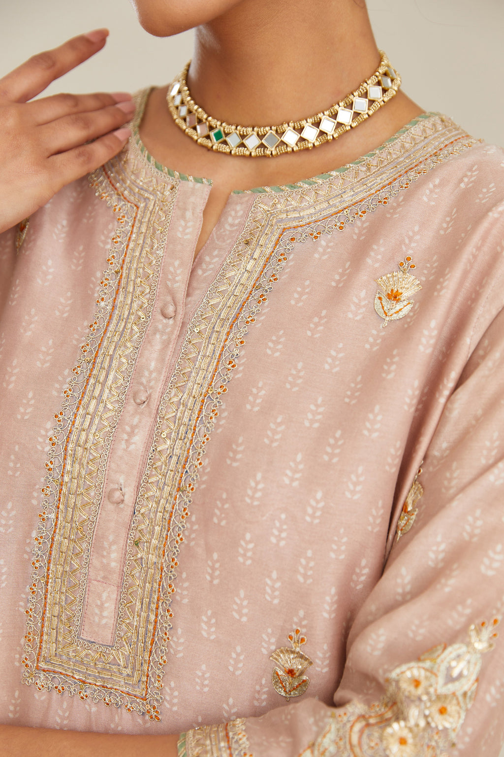 Old rose hand block printed silk chanderi short kurta set, highlighted with gold gota and zari embroidery.