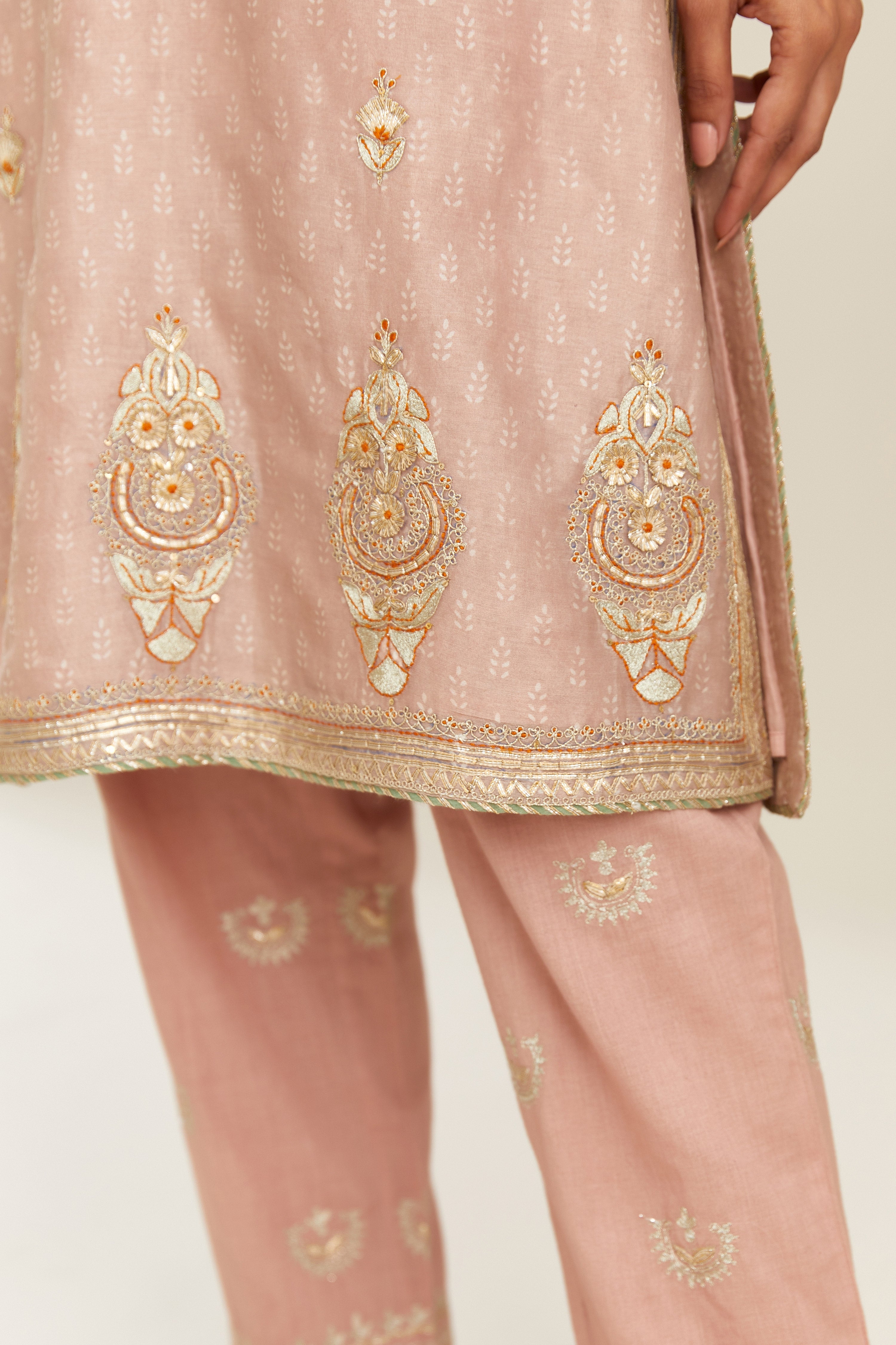 Old rose hand block printed silk chanderi short kurta set, highlighted with gold gota and zari embroidery.