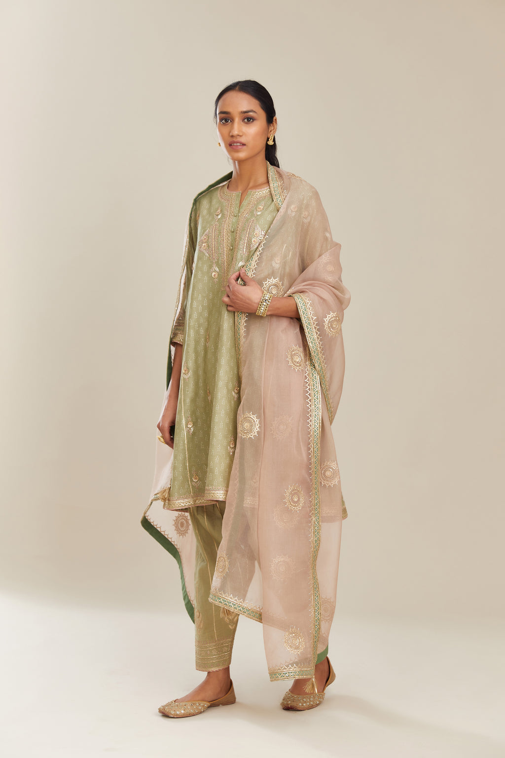 Sage green hand block printed short kalidar silk chanderi kurta set with button placket and all over gold gota and zari embroidery.