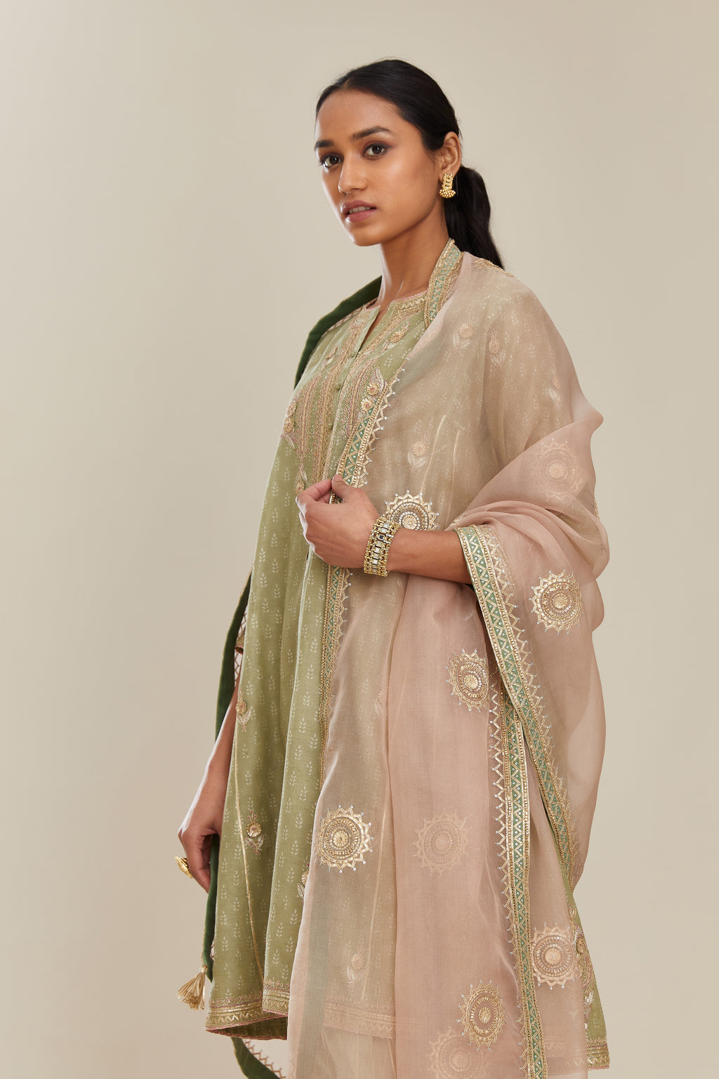 Sage green hand block printed short kalidar silk chanderi kurta set with button placket and all over gold gota and zari embroidery.