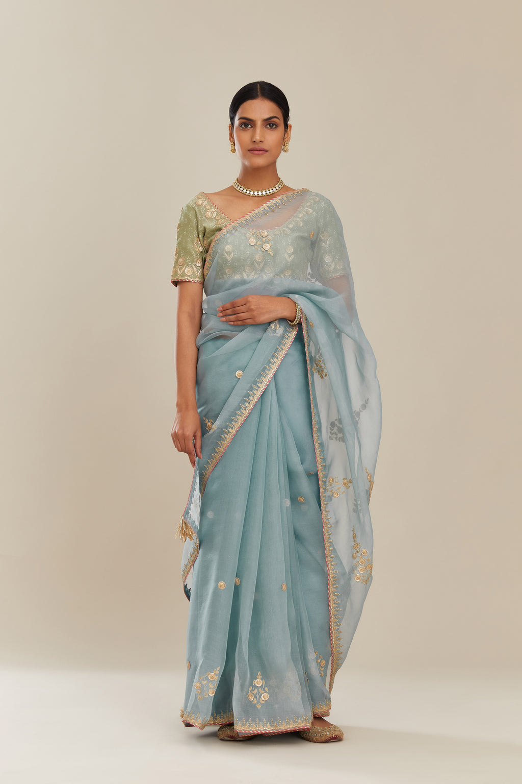 Blue silk organza saree with delicate gold gota and zari embroidery border.