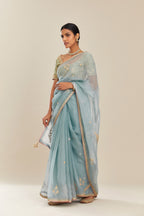 Blue silk organza saree with delicate gold gota and zari embroidery border. and blouse