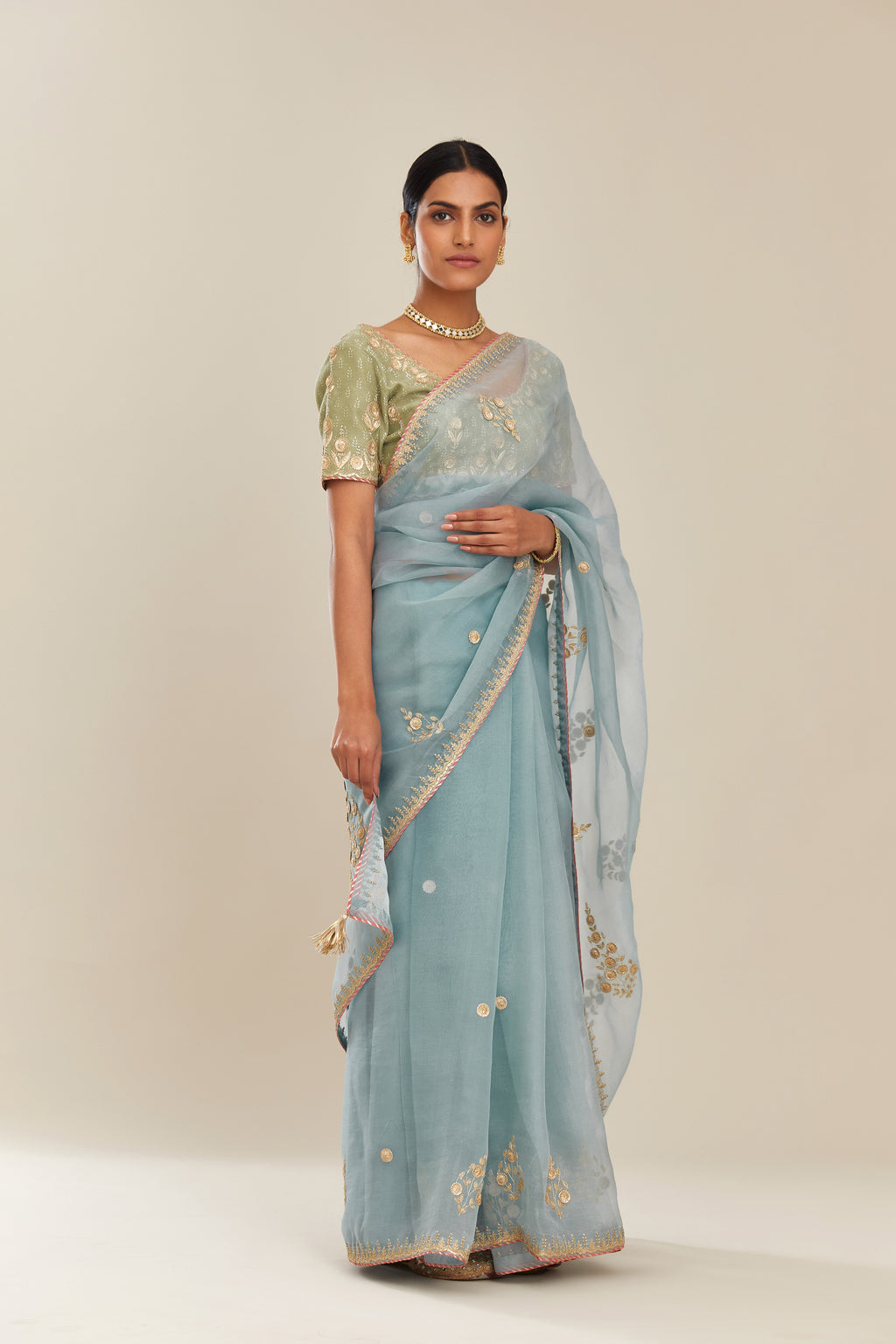 Blue silk organza saree with delicate gold gota and zari embroidery border. and blouse